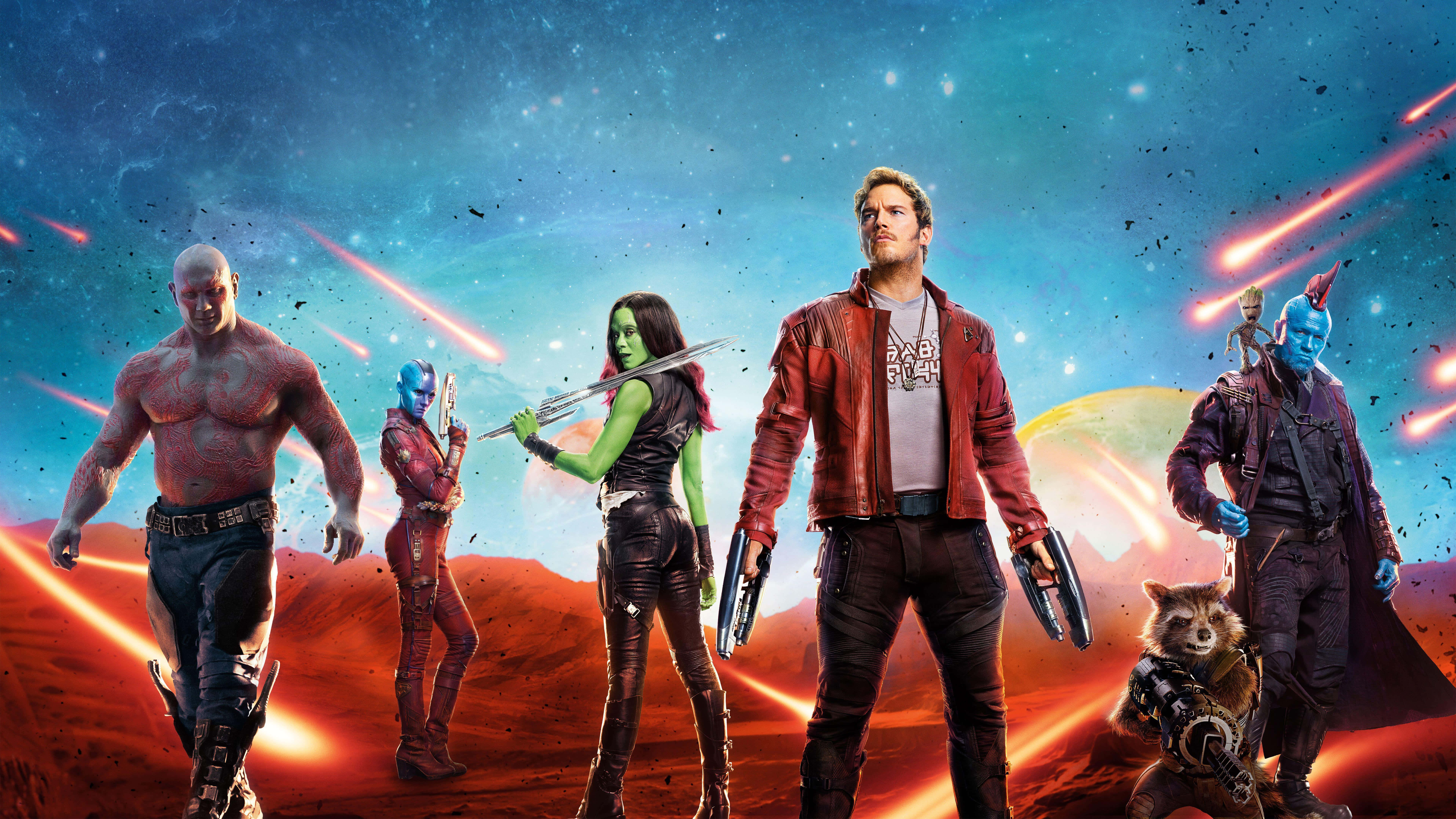 Guardians Of The Galaxy 2 桌布 壁紙 — 星際異攻隊英雄式地站在一個熾熱的外星行星上，星空宇宙天空中有流星劃過。
