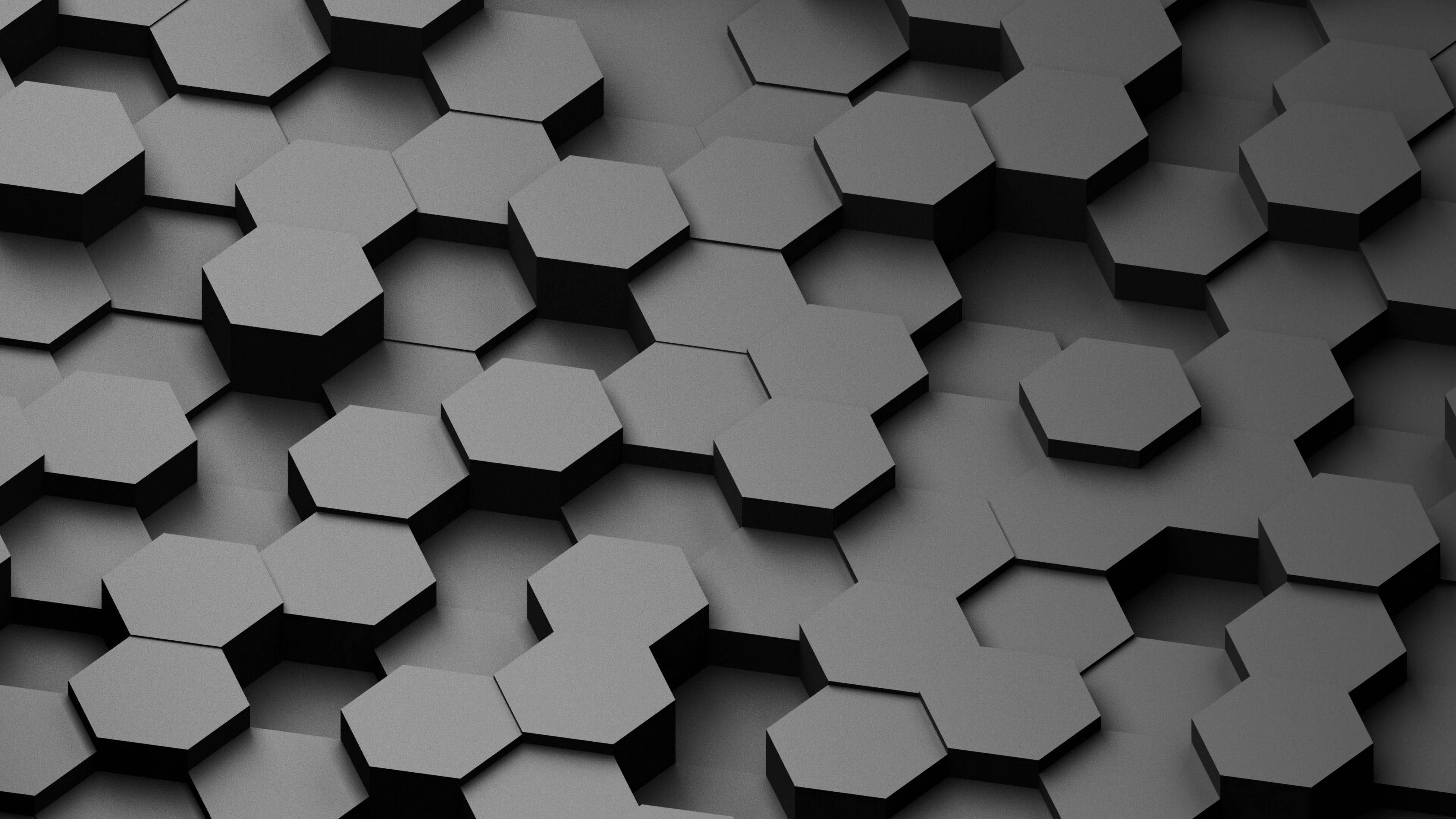 Honeycomb 桌布 壁紙 — 時尚深灰色六角形瓷磚圖案的近距離特寫，柔和陰影營造出現代幾何紋理。