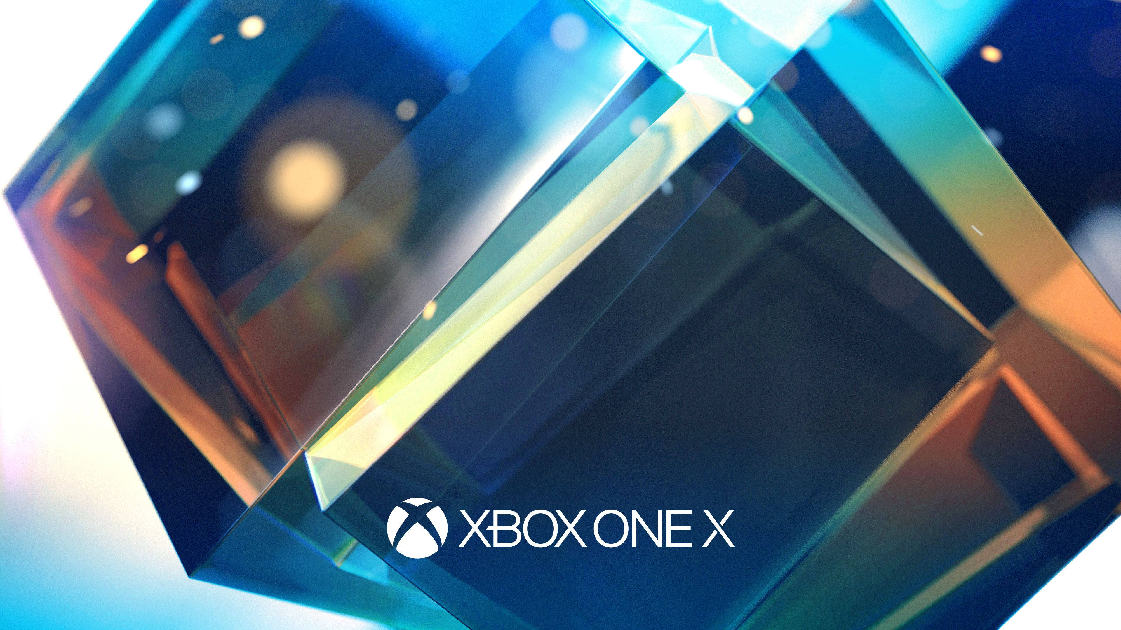 Xbox 桌布 壁紙 — 時尚的幾何水晶折射出鮮豔的藍色和金色光芒，中央是 Xbox One X 標誌。