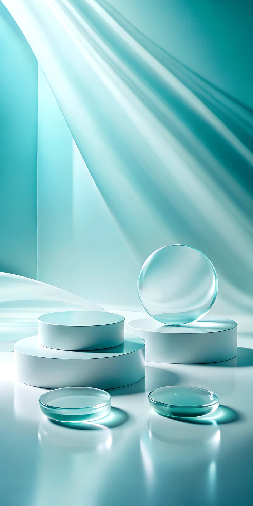 Minimalist Frosted Glass Shapes Drifting in a Soft Modern Tone 壁紙 — 時尚的玻璃球體和圓柱體放置在分層的白色底座上，下方是流動的藍綠色布料，位於極簡主義的工作室中。