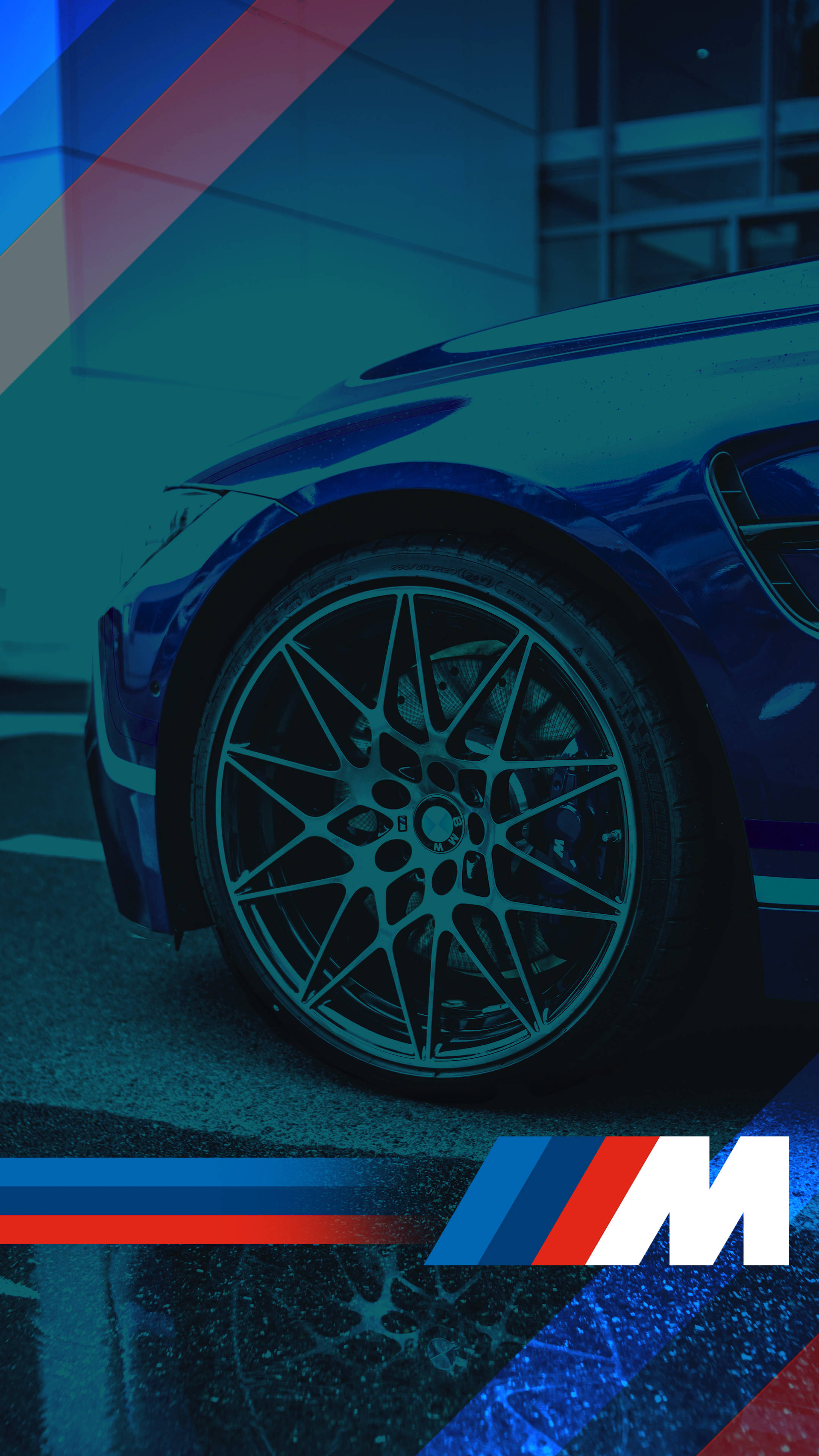 BMW 動圖 桌布 壁紙 — 時尚的藍色BMW M汽車輪圈在霓虹燈下閃耀，大膽的紅、藍、白條紋框住畫面。