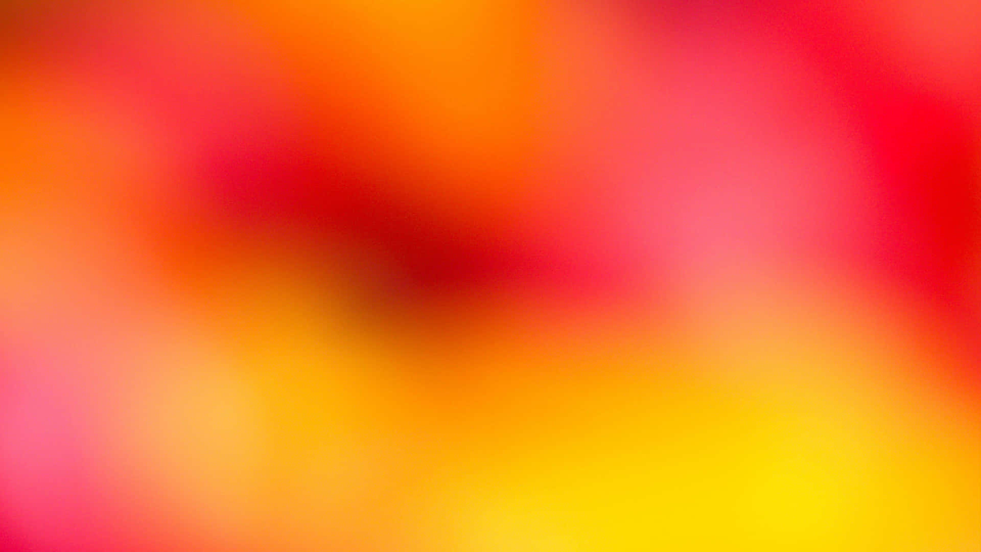 彩色動圖 桌布 壁紙 — 暖紅色、橙色和黃色的柔和漸變，融合成夢幻般的抽象背景。