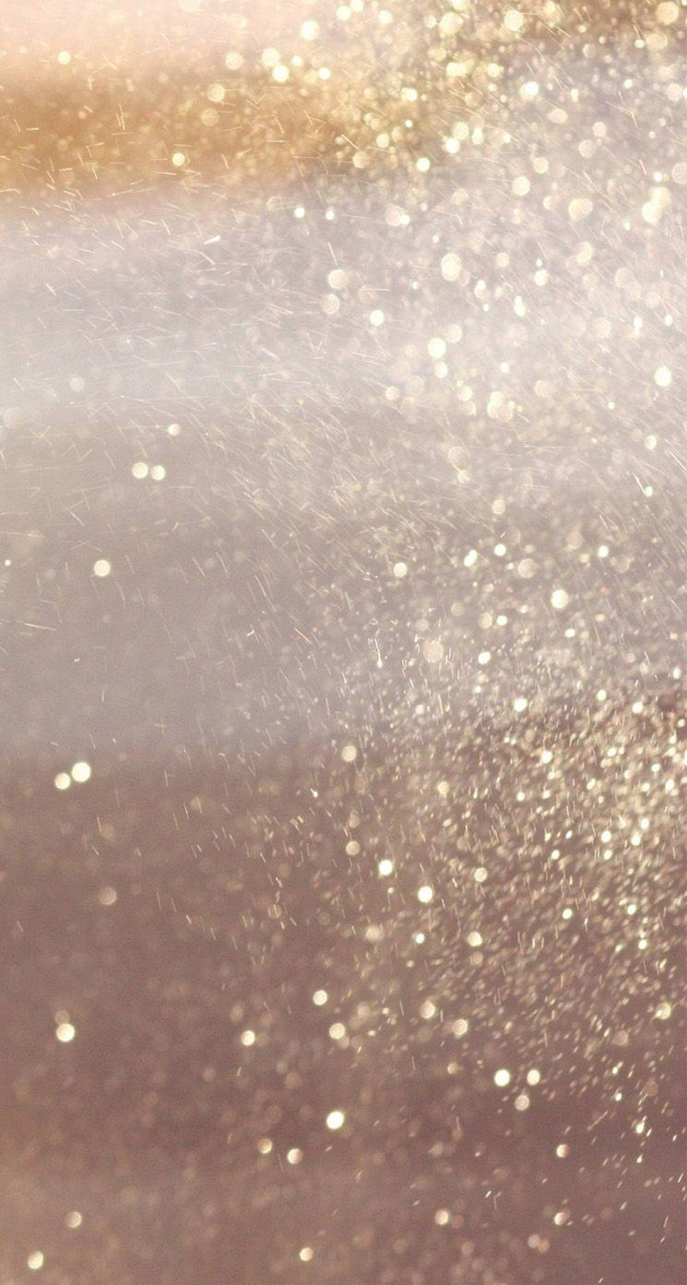 Bokeh 桌布 壁紙 — 暖金色和玫瑰色調的柔和漸變，閃爍著散落的亮粉顆粒，營造出奢華夢幻的效果。