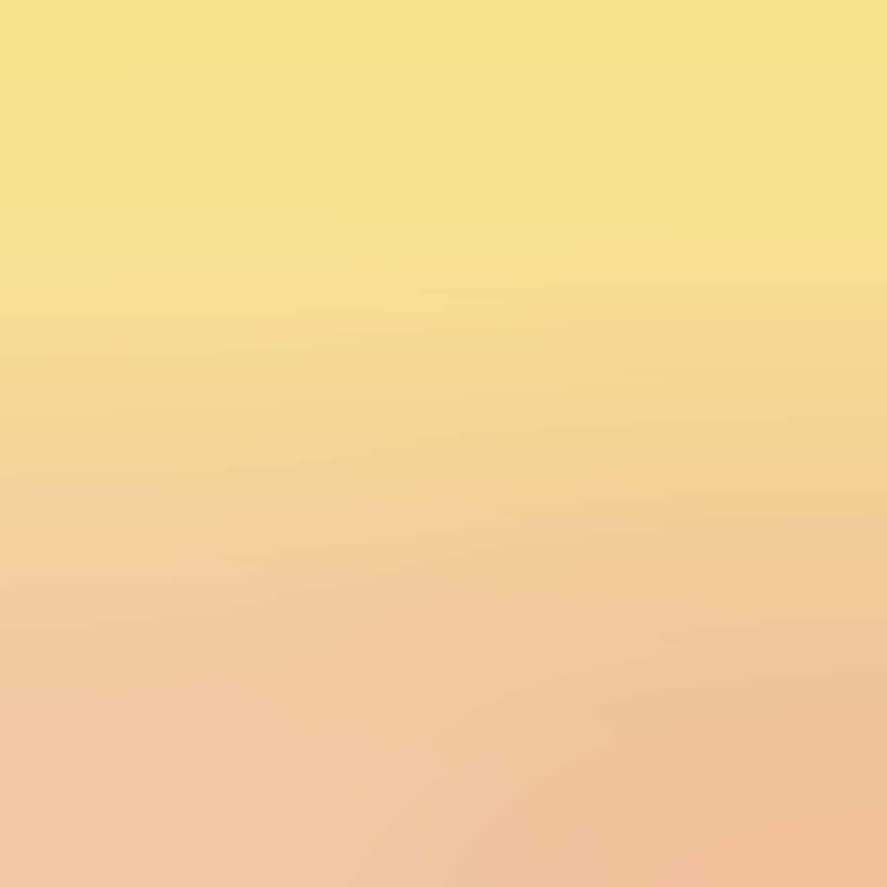 Yellow Gradient 桌布 壁紙 — 暖黃色與蜜桃色調的柔和漸變，無縫融合於整個畫面。