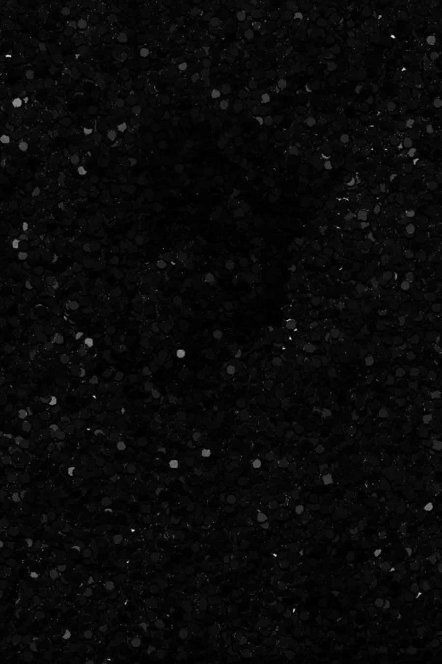 Black Glitter 桌布 壁紙 — 暗色紋理表面的特寫，帶有散落的閃亮斑點捕捉光線。