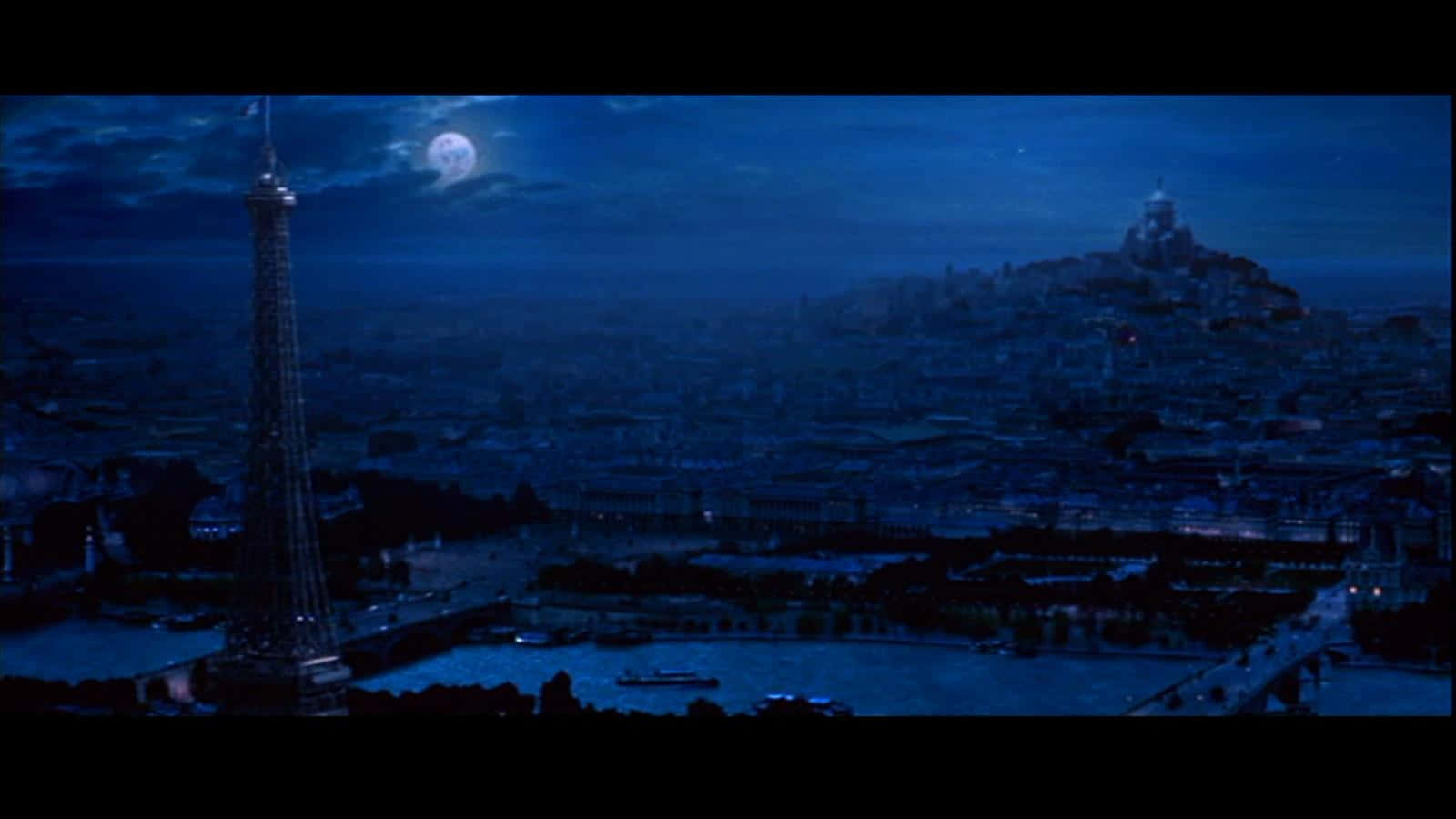  壁紙 — 月光下的巴黎夜景，艾菲爾鐵塔和蒙馬特在深藍色天空的襯托下呈現剪影。