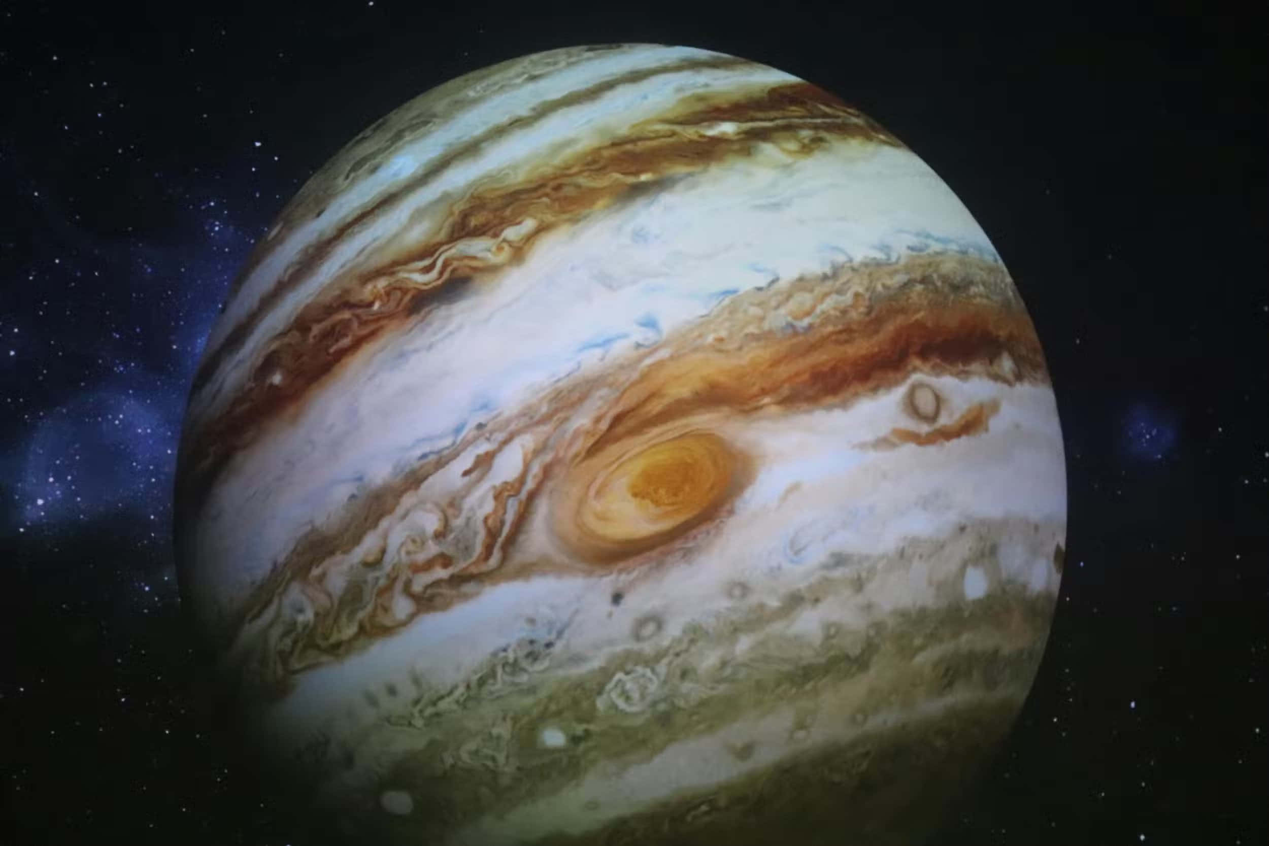 木星 桌布 壁紙 — 木星主導整個畫面，奶油色、棕色和白色的旋轉帶狀紋理在繁星宇宙背景下格外突出。