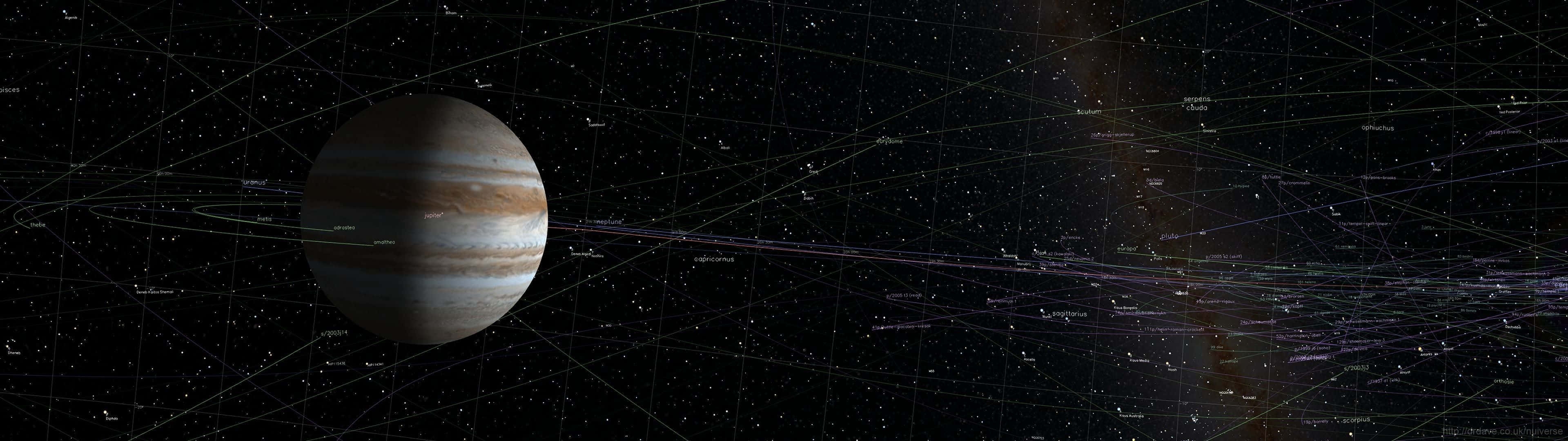 桌布 壁紙 — 木星在佈滿星辰的夜空下顯得巨大，星空被發光的宇宙細絲和遙遠星雲穿透。