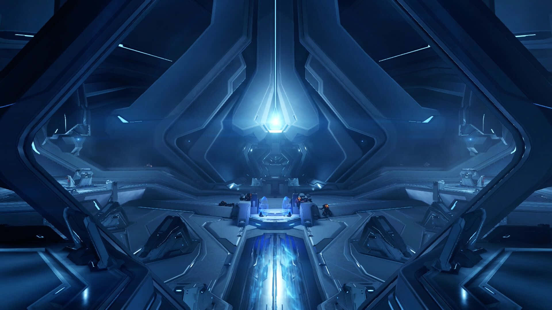 Halo Forerunner 桌布 壁紙 — 未來主義太空船內部，沐浴在冷藍光中，帶有發光的中央核心和棱角分明的金屬牆壁。