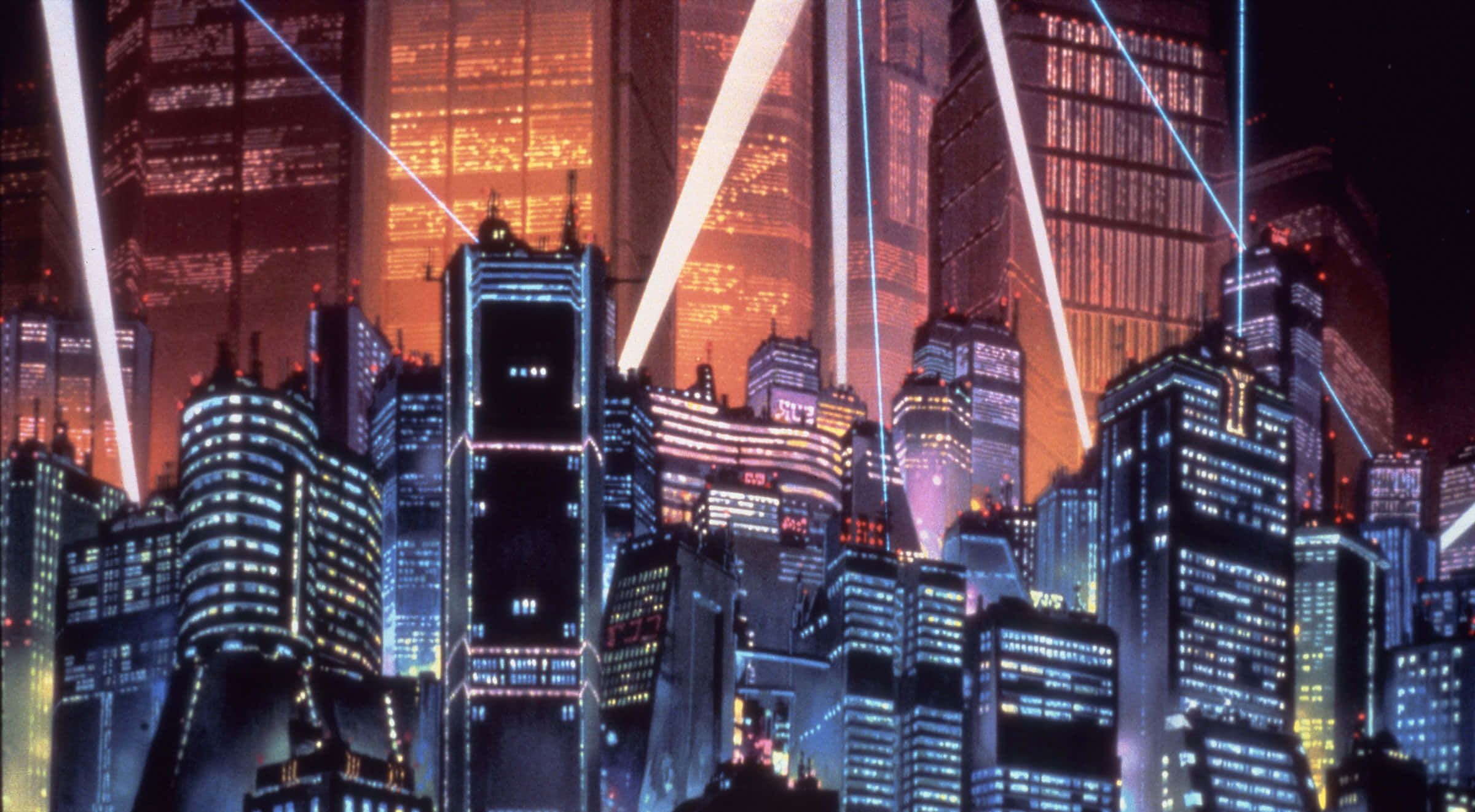 動漫城市 桌布 壁紙 — 未來主義的夜景城市景觀，高聳的摩天大樓閃爍著霓虹燈光，雷射光束在建築物之間穿梭。