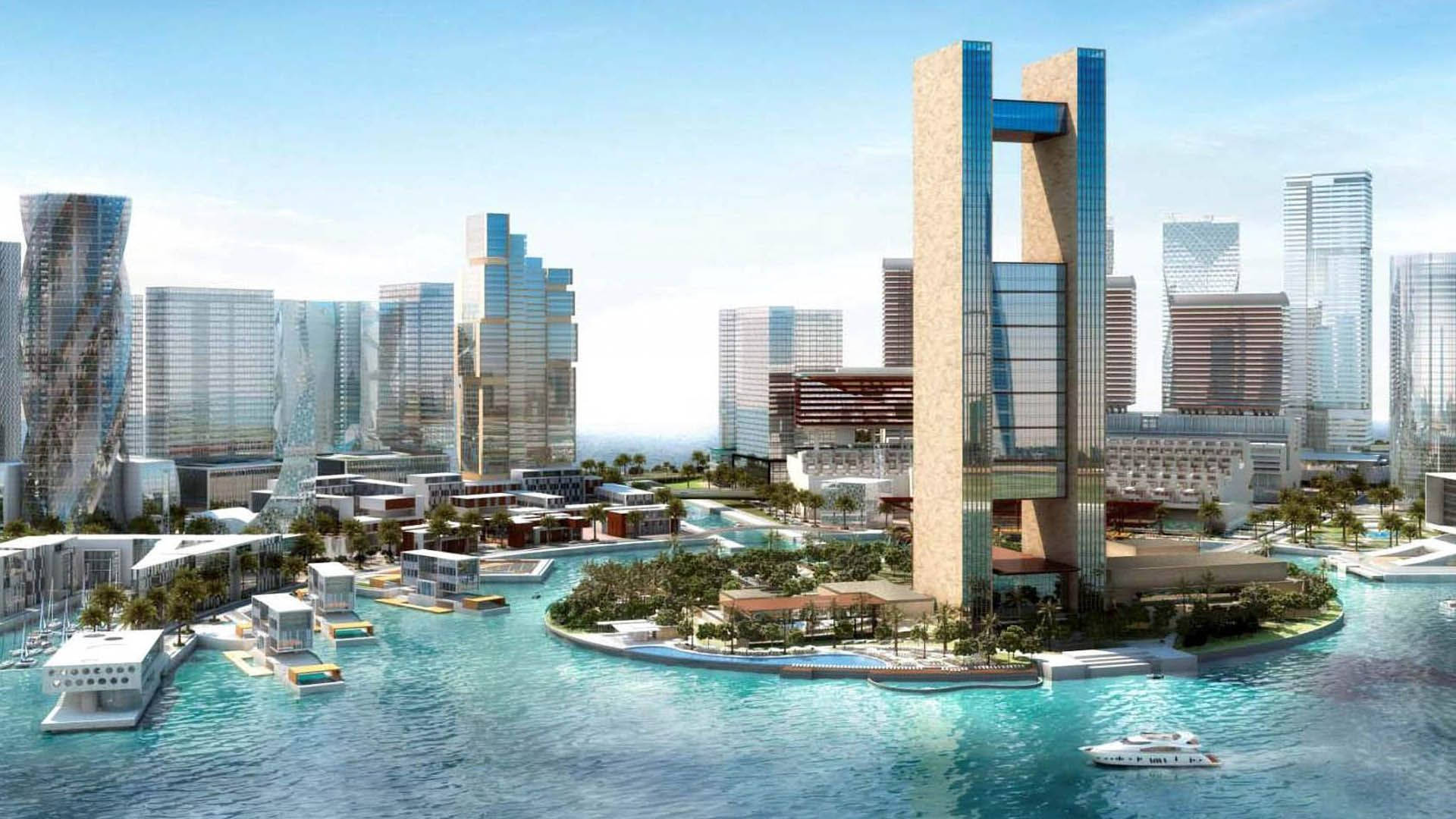 Bahrain 桌布 壁紙 — 未來主義的海濱城市景觀，玻璃摩天大樓和中央塔樓被碧綠的海水和棕櫚樹環繞。