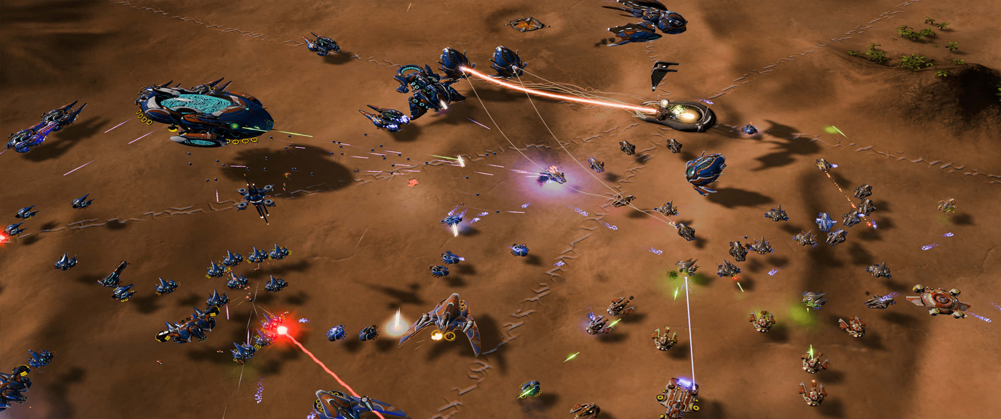 3440x1440p Ashes Of The Singularity Escalation 桌布 壁紙 — 未來太空船在不毛的沙漠星球上戰鬥，雷射火和爆炸照亮了塵土飛揚的地形。