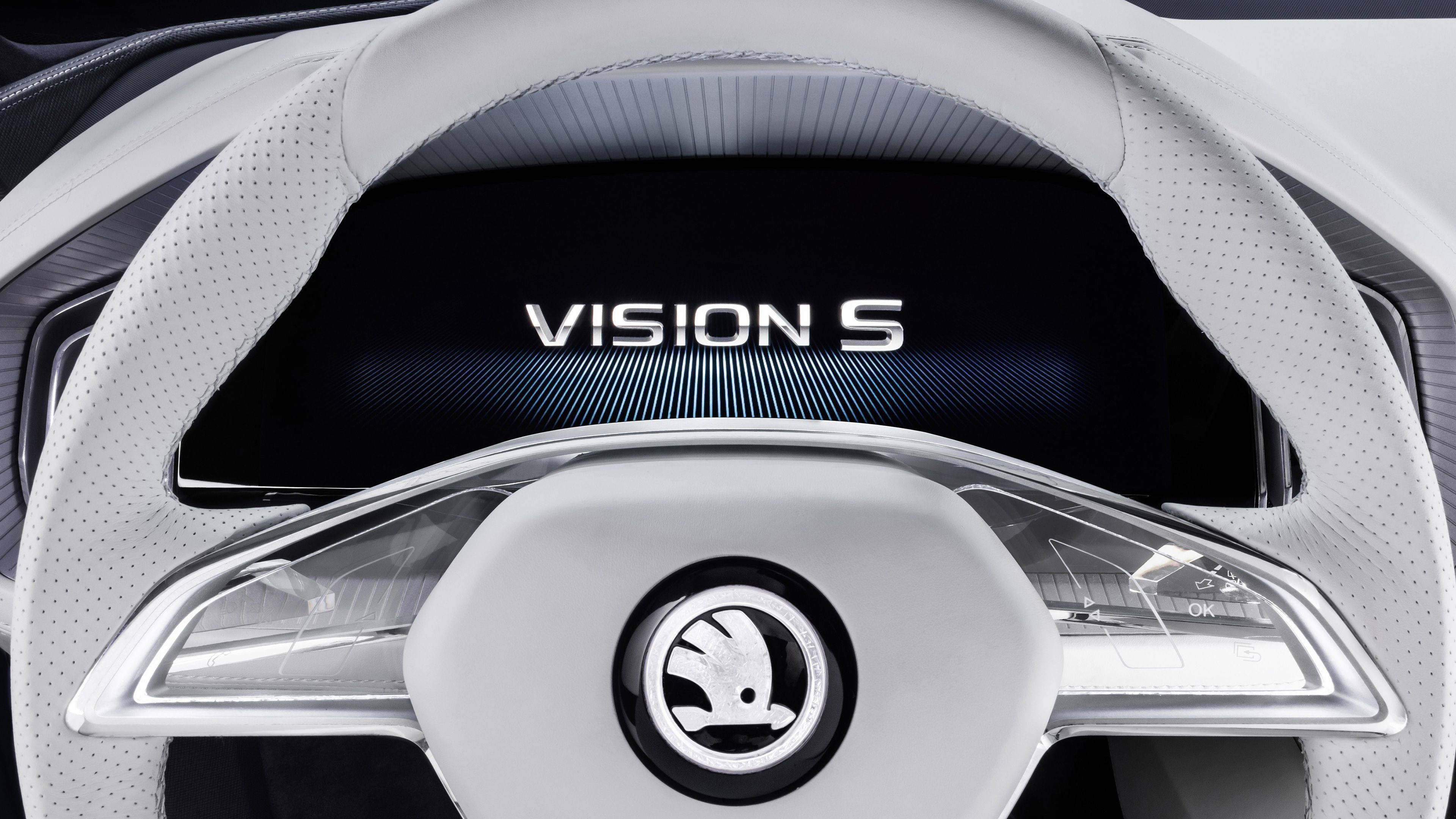 Skoda 桌布 壁紙 — 未來感白色方向盤特寫，帶有 'VISION S' 顯示螢幕和 Skoda 標誌。