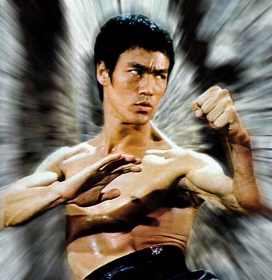 李小龍 桌布 壁紙 — 李小龍擺出動態武術姿勢，身體散發出動態模糊效果。