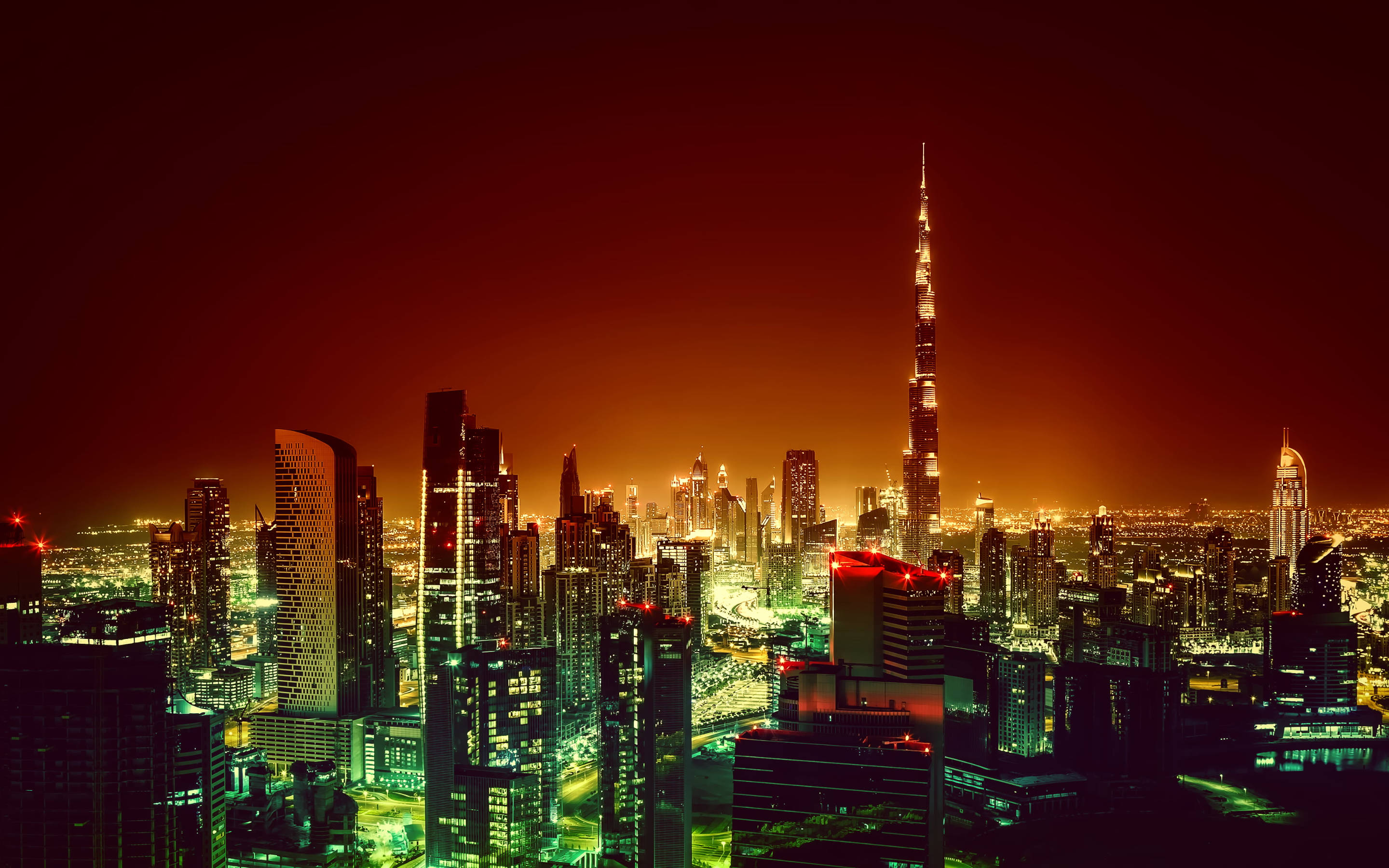 夜空 桌布 壁紙 — 杜拜充滿活力的夜景，哈利法塔在火紅的橙色天空下閃耀。