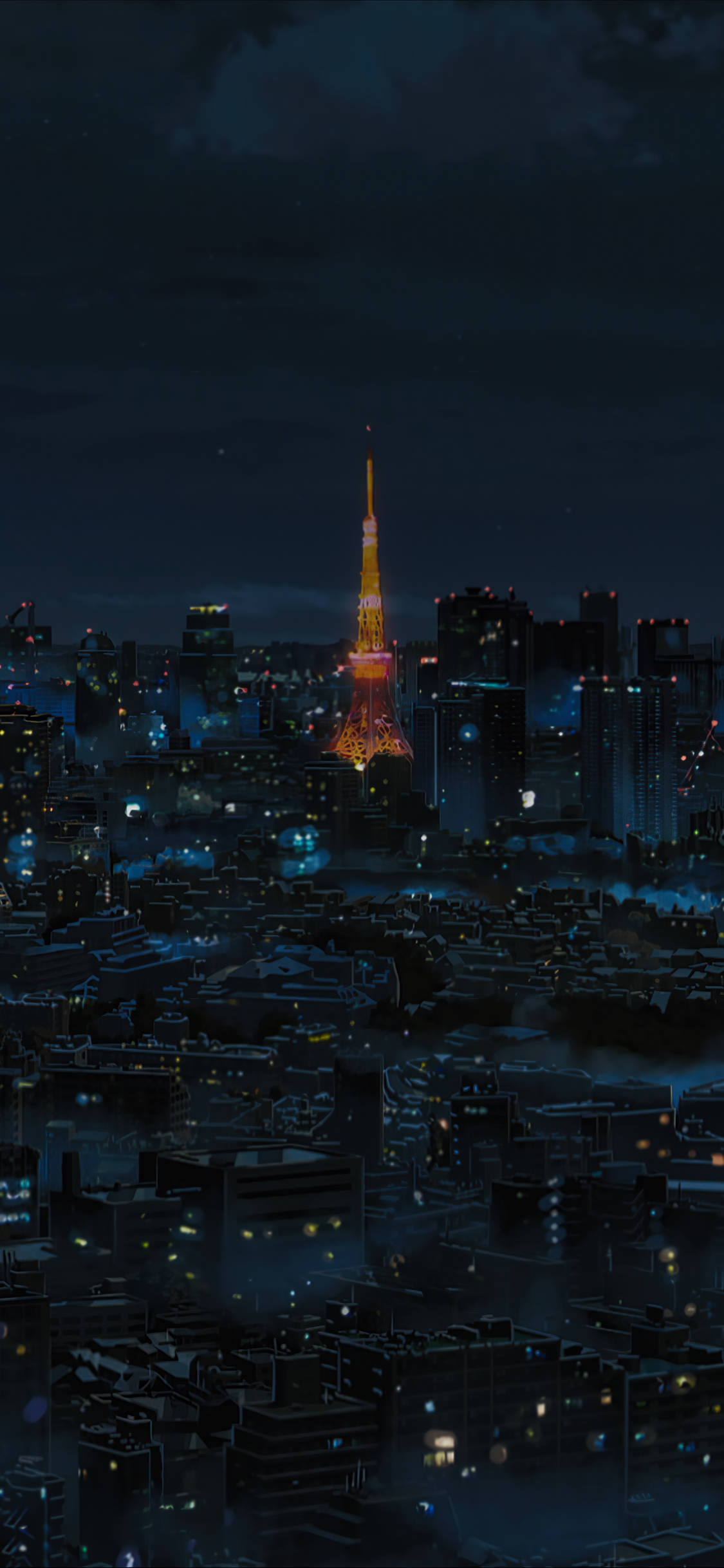 東京 桌布 壁紙 — 東京塔在漆黑的夜空下溫暖地發光，城市燈光在下方迷濛的城市全景中閃爍。