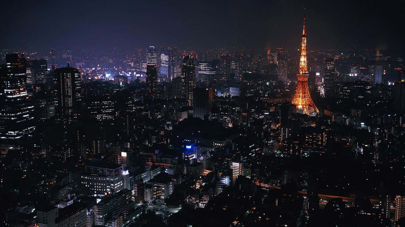 Laptop 1366 X 768 桌布 壁紙 — 東京天際線的空中夜景，被發光的東京鐵塔在密集的城市燈光中主導。