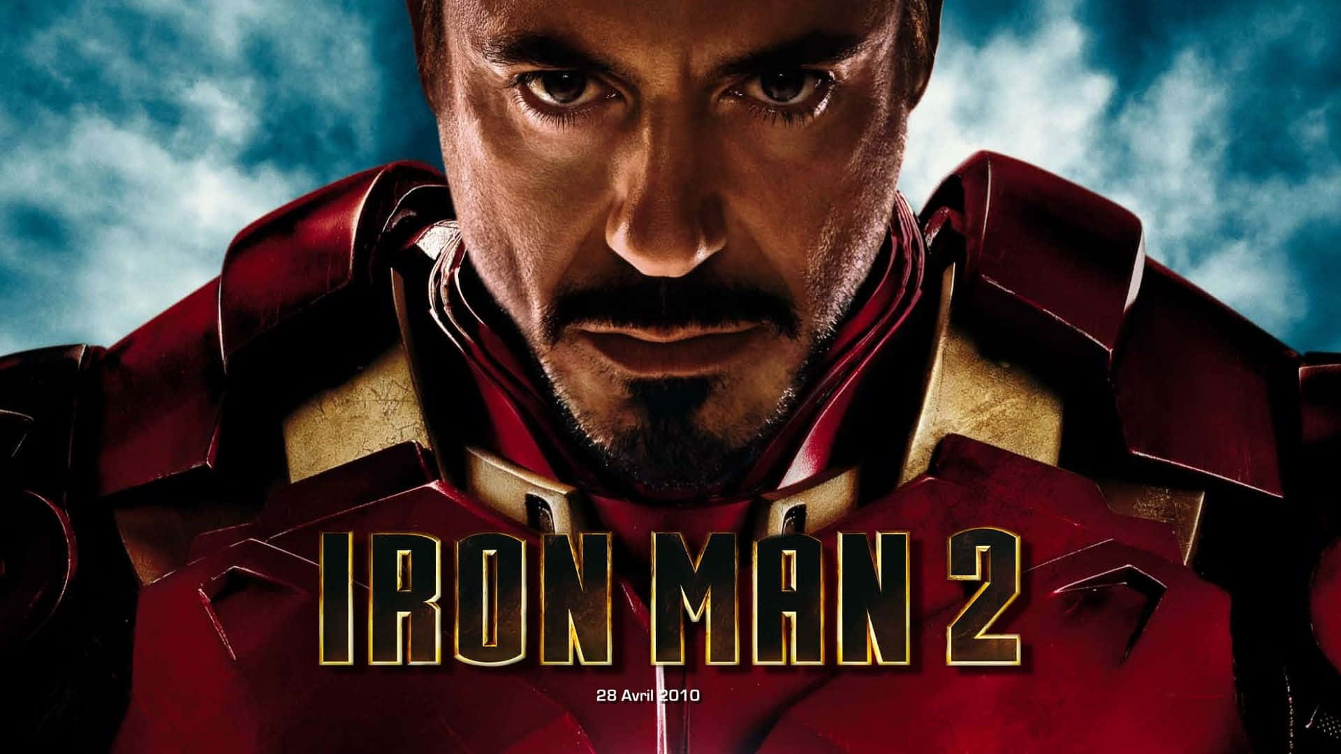 Iron Man Movies 桌布 壁紙 — 東尼史塔克穿上紅色和金色鋼鐵人盔甲的特寫，眼神銳利，背景是暴風雨的藍天。