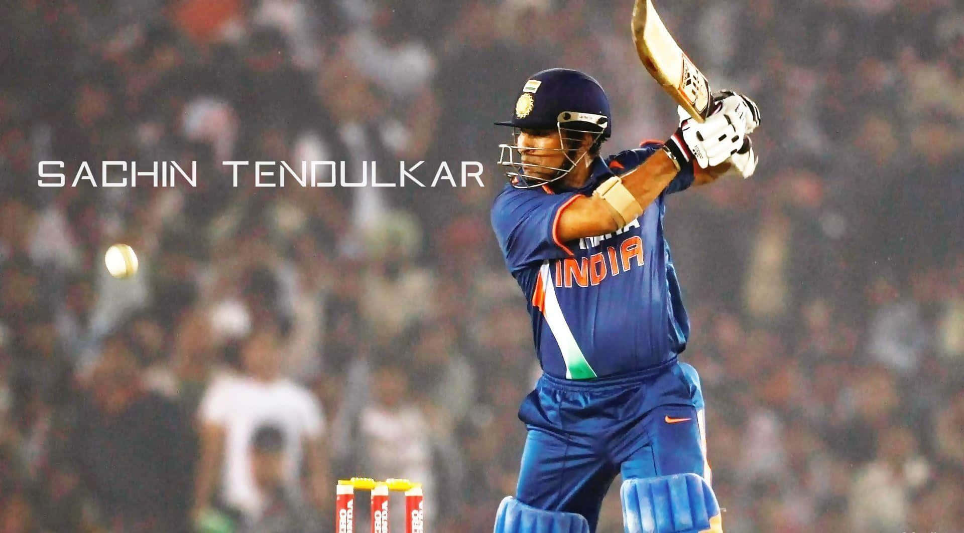 Sachin Tendulkar 桌布 壁紙 — 板球傳奇沙欽·坦杜卡穿上藍色印度隊服，在夜間球場燈光下揮棒擊球。