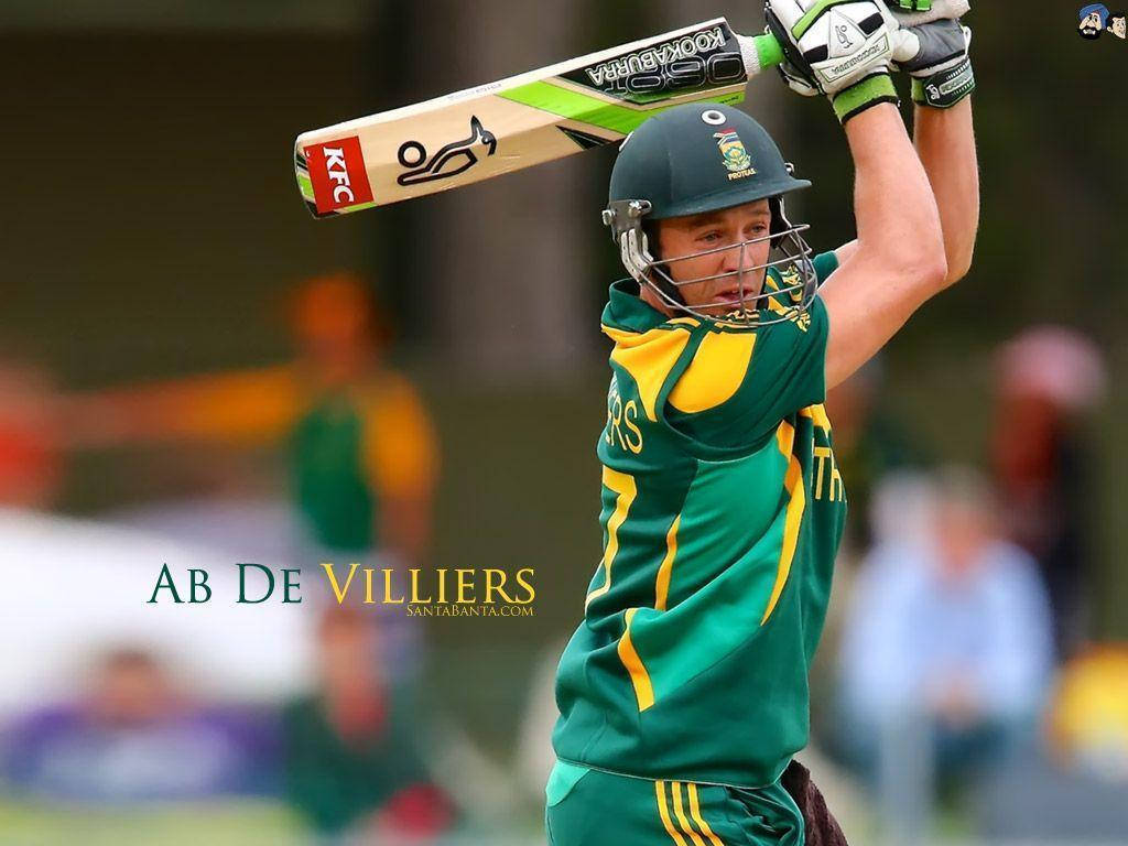 royal challengers bangalore 桌布 壁紙 — 板球球員AB de Villiers身穿綠色和黃色球衣，在比賽中揮棒時得意地舉起球棒。