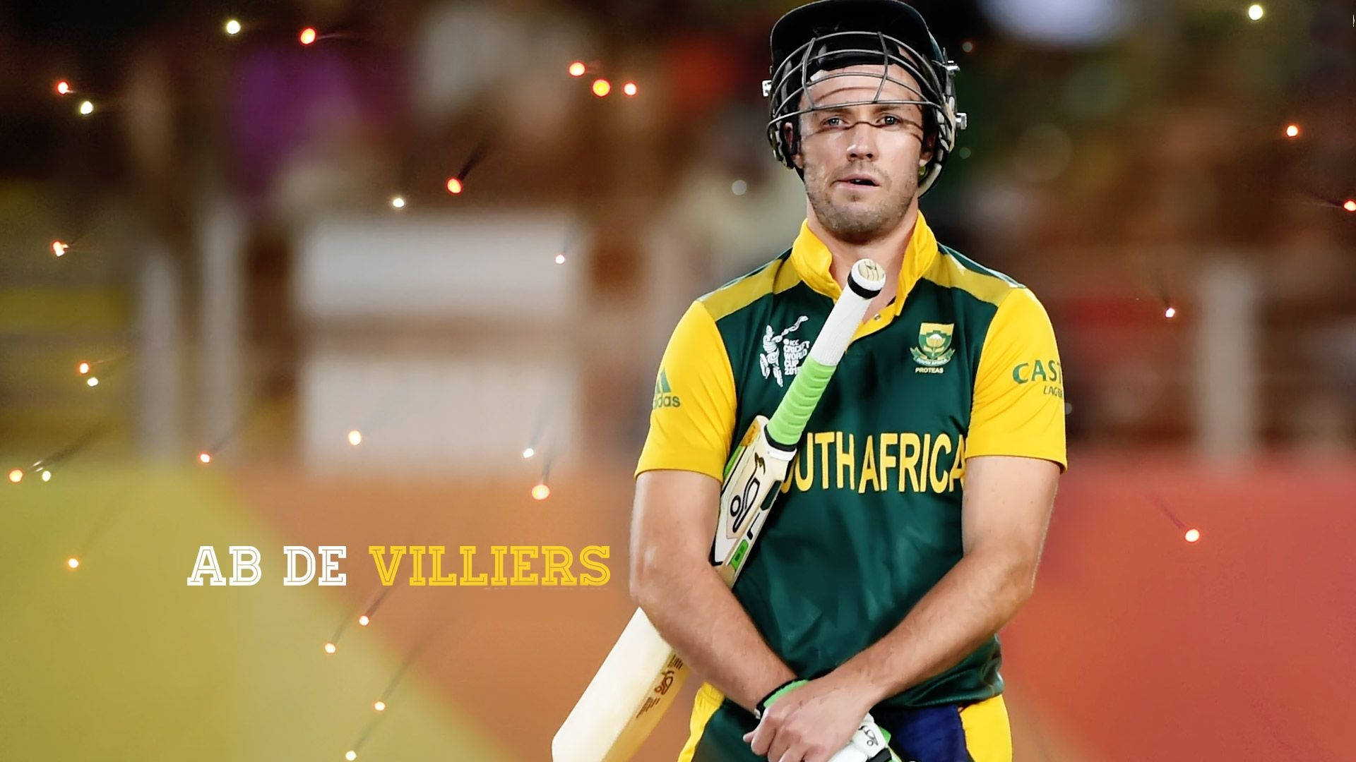 south africa cricket 桌布 壁紙 — 板球運動員 AB de Villiers 身穿南非球衣，在夜間散景球場燈光下持球棒。