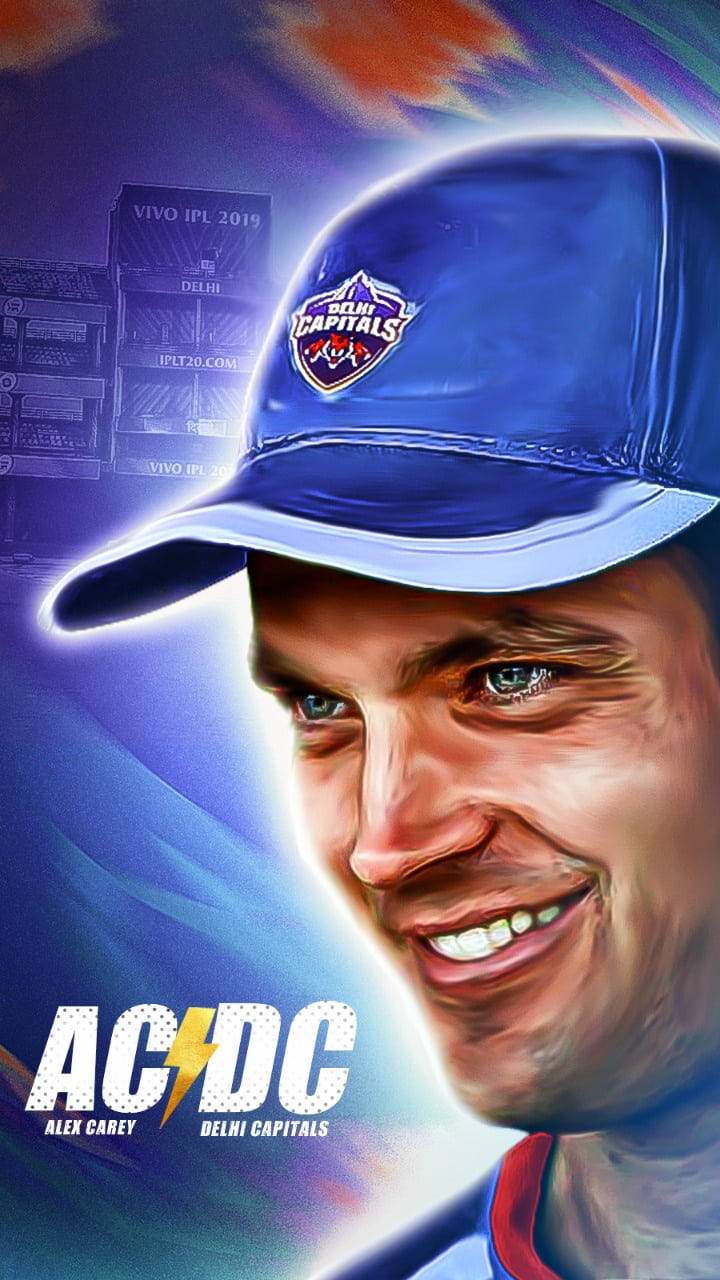 Delhi Capitals 桌布 壁紙 — 板球運動員亞歷克斯·凱里（Alex Carey）戴著德里首都隊（Delhi Capitals）帽子，在發光的抽象背景前微笑的充滿活力的數位肖像。
