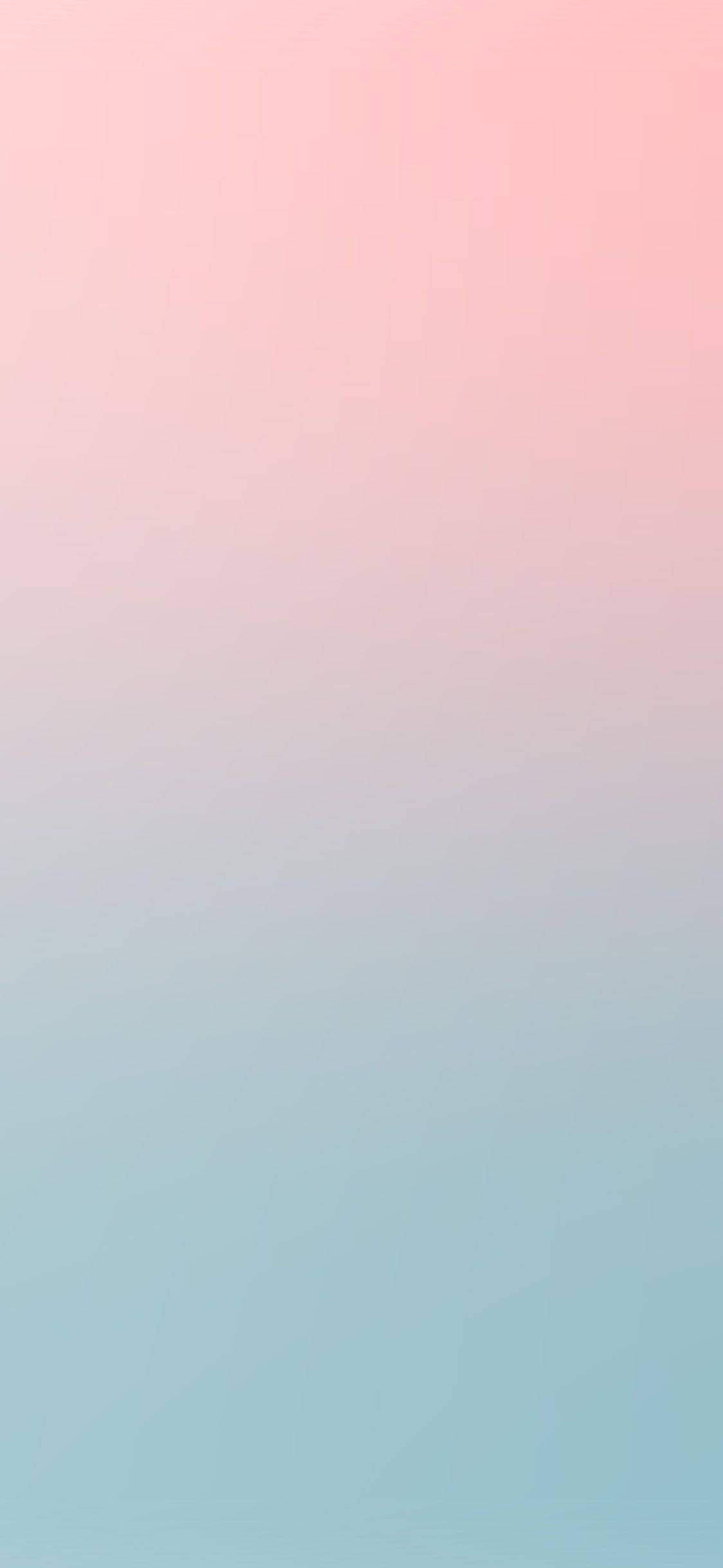 Pastel Pink iPhone 桌布 壁紙 — 柔和漸層壁紙，從粉紅色過渡到淺藍色，帶有細微的幾何紋理。