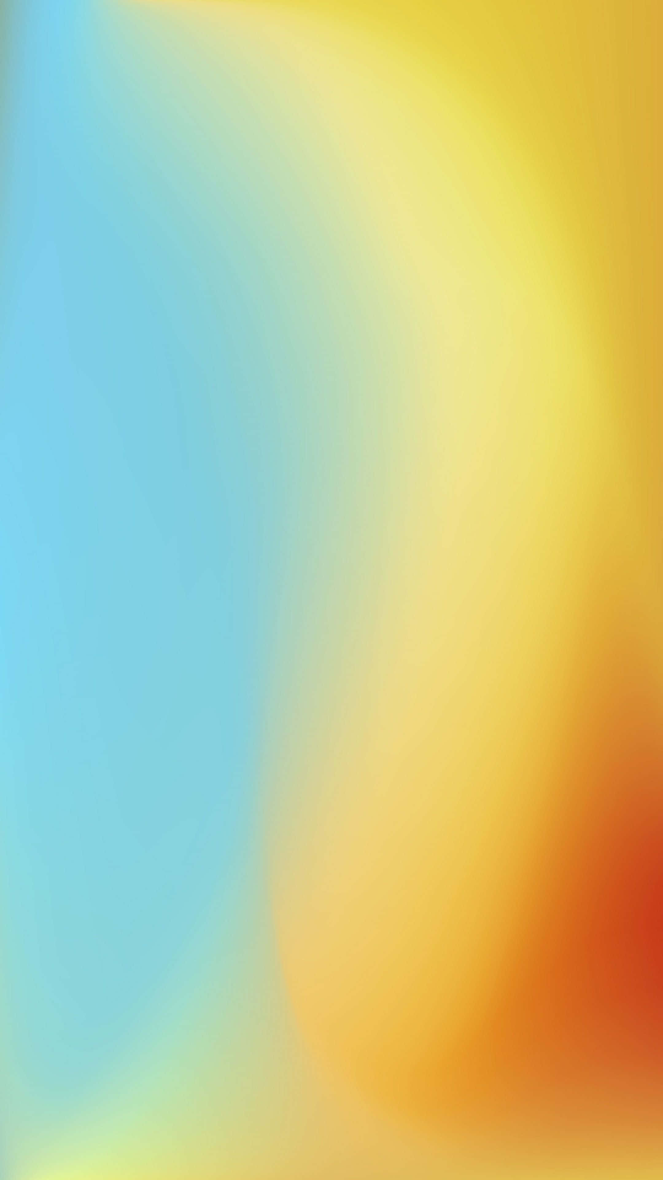 Yellow Gradient 桌布 壁紙 — 柔和漸變，將冷藍色與溫暖的黃色和橙色色調融合成流暢的抽象流動。