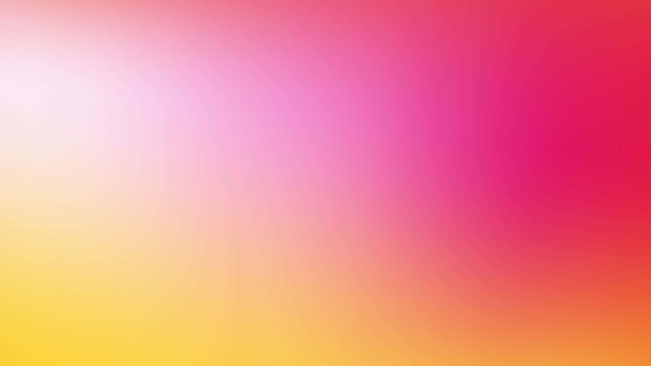 Yellow Gradient 桌布 壁紙 — 柔和漸變從淡黃色過渡到鮮豔的粉紅色和紅色，遍佈整個畫面。