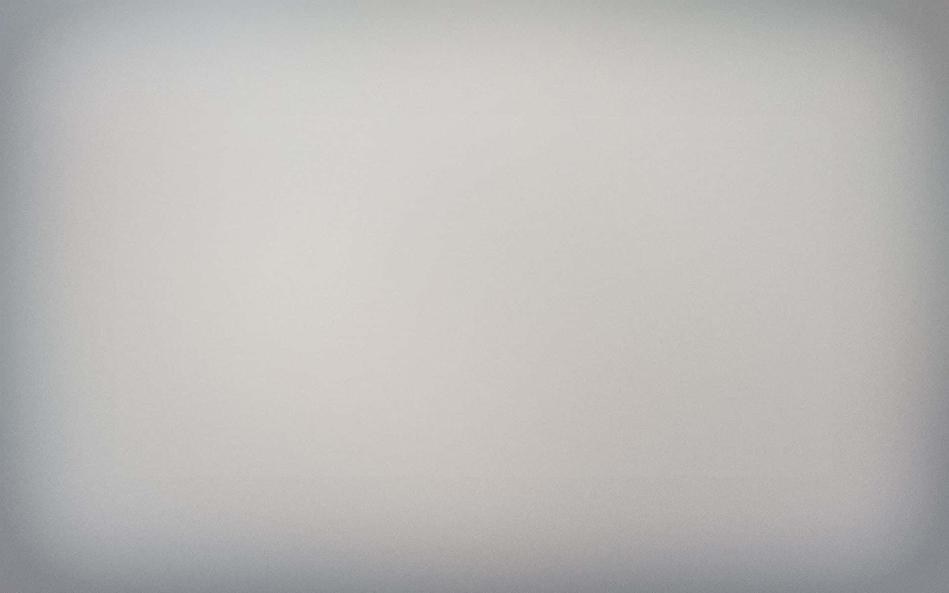 Grey Gradient 桌布 壁紙 — 柔和漸變灰色背景，帶有微妙的暗角和顆粒紋理，適合極簡設計。