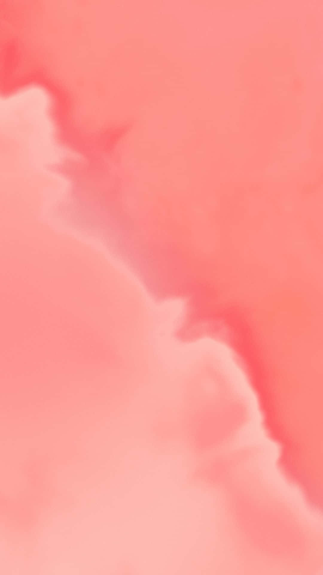 柔和粉紅色調的抽象水彩藝術品，帶有混合的雲朵般紋理。 — Google pixel 壁紙