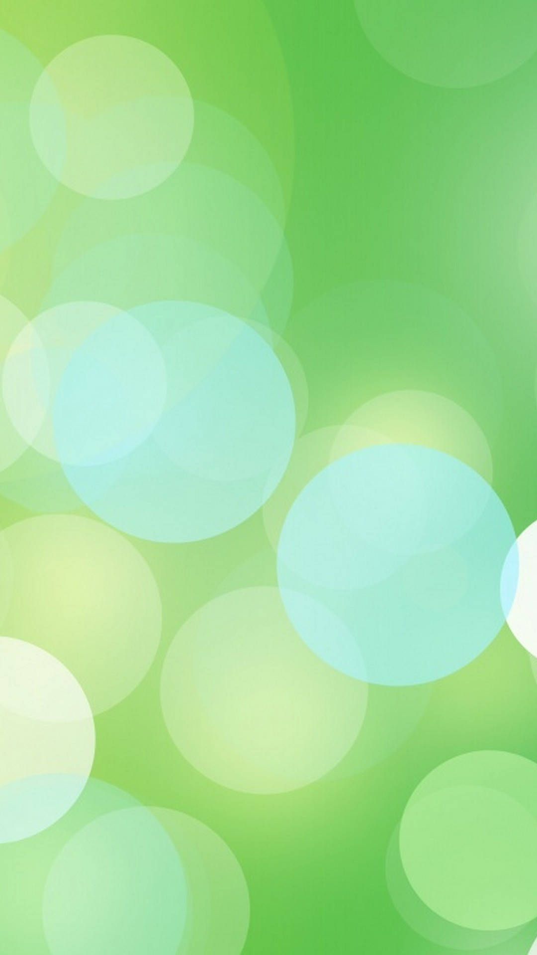 Bokeh 桌布 壁紙 — 柔和發光的圓圈，呈現不同深淺的綠色和藍綠色，漂浮在漸變背景上。