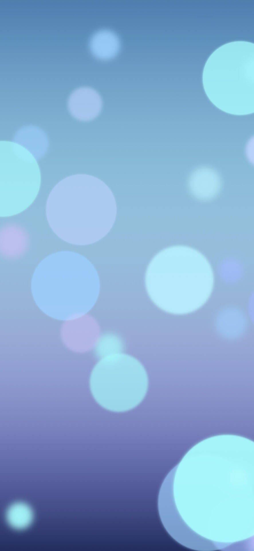 Bokeh 桌布 壁紙 — 柔和發光的圓圈漂浮在藍色和紫色的漸變天空中，營造出夢幻般的抽象背景。