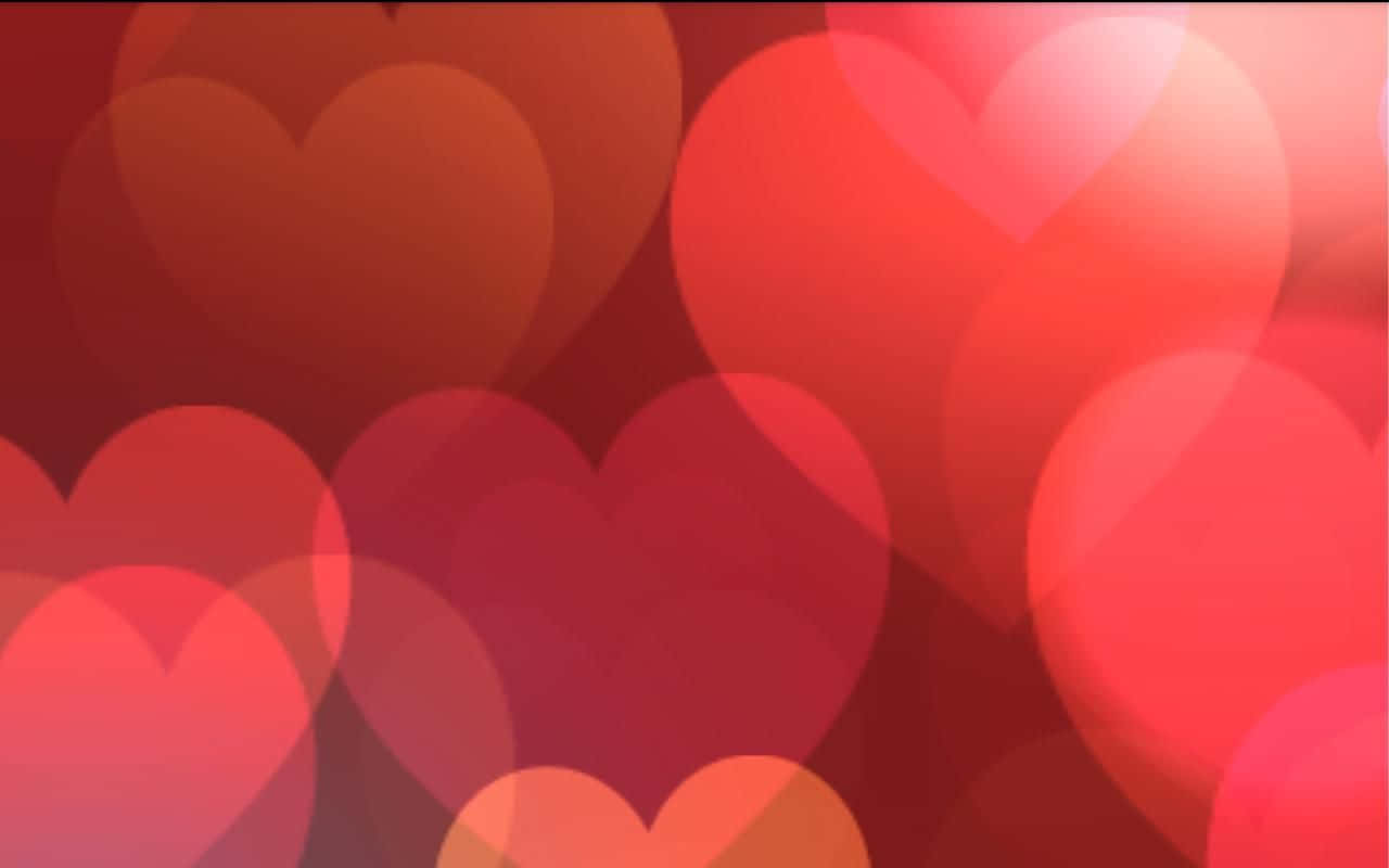 Valentines 桌布 壁紙 — 柔和發光的愛心在溫暖的紅色和粉紅色中漂浮在夢幻般的散景背景中。