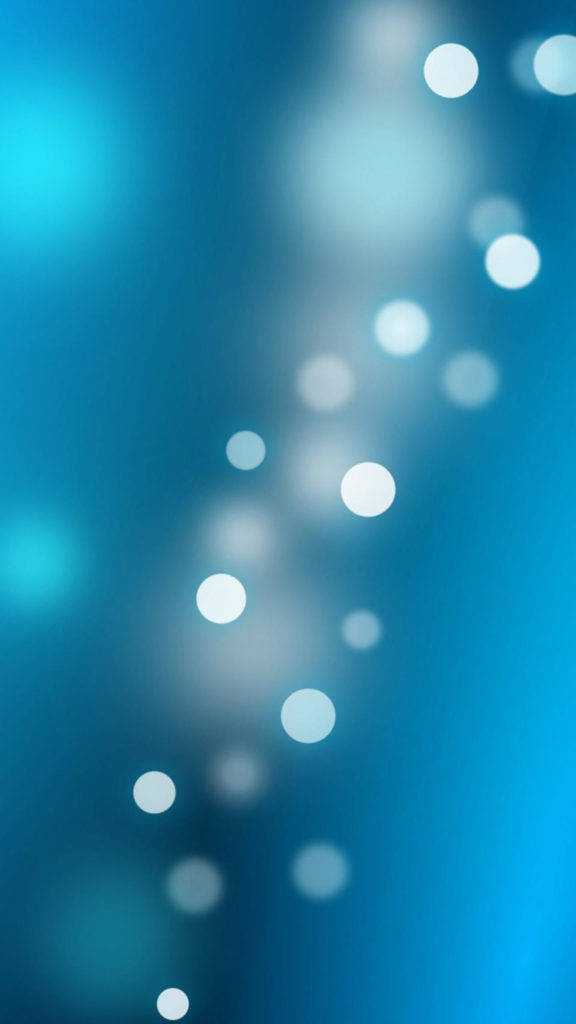 Bokeh 桌布 壁紙 — 柔和發光的球體在漸變藍色背景中飄移，營造出寧靜夢幻的抽象場景。