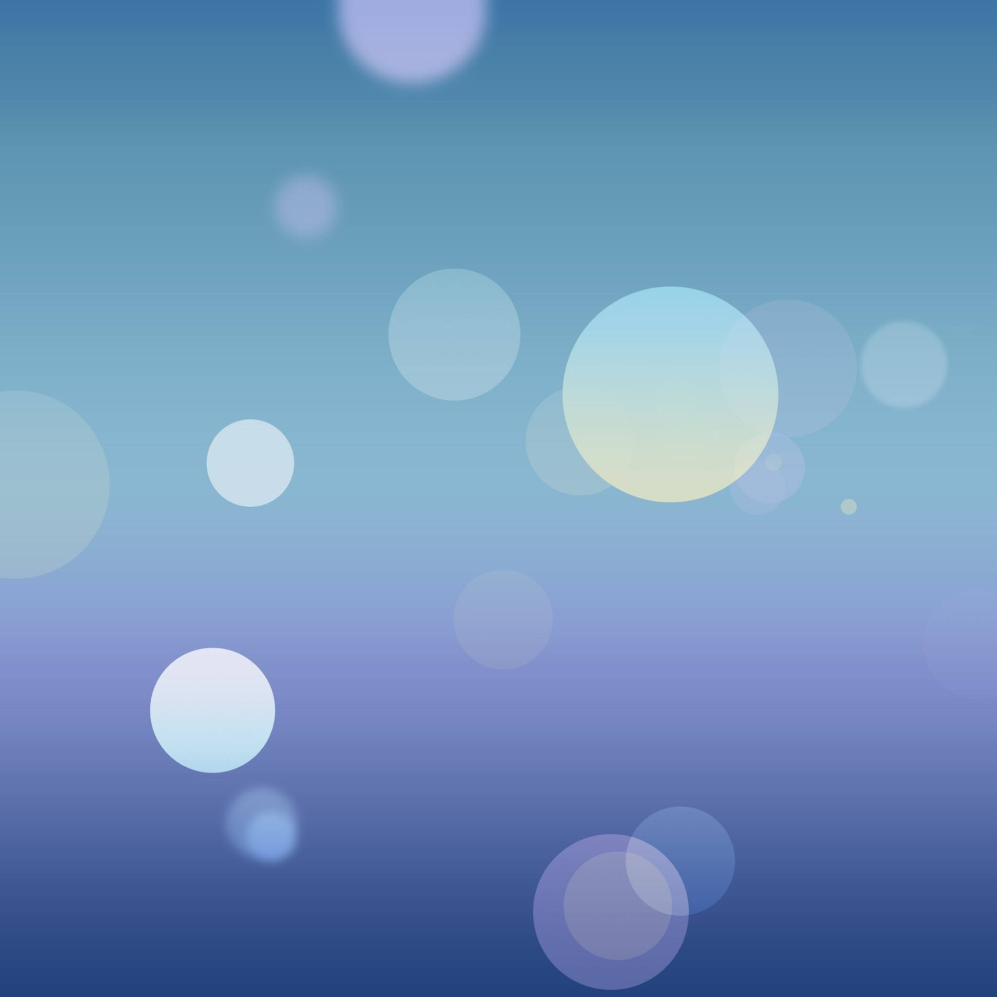 iOS 7 桌布 壁紙 — 柔和發光的球體漂浮在漸變藍色背景上，營造出夢幻空靈的氛圍。