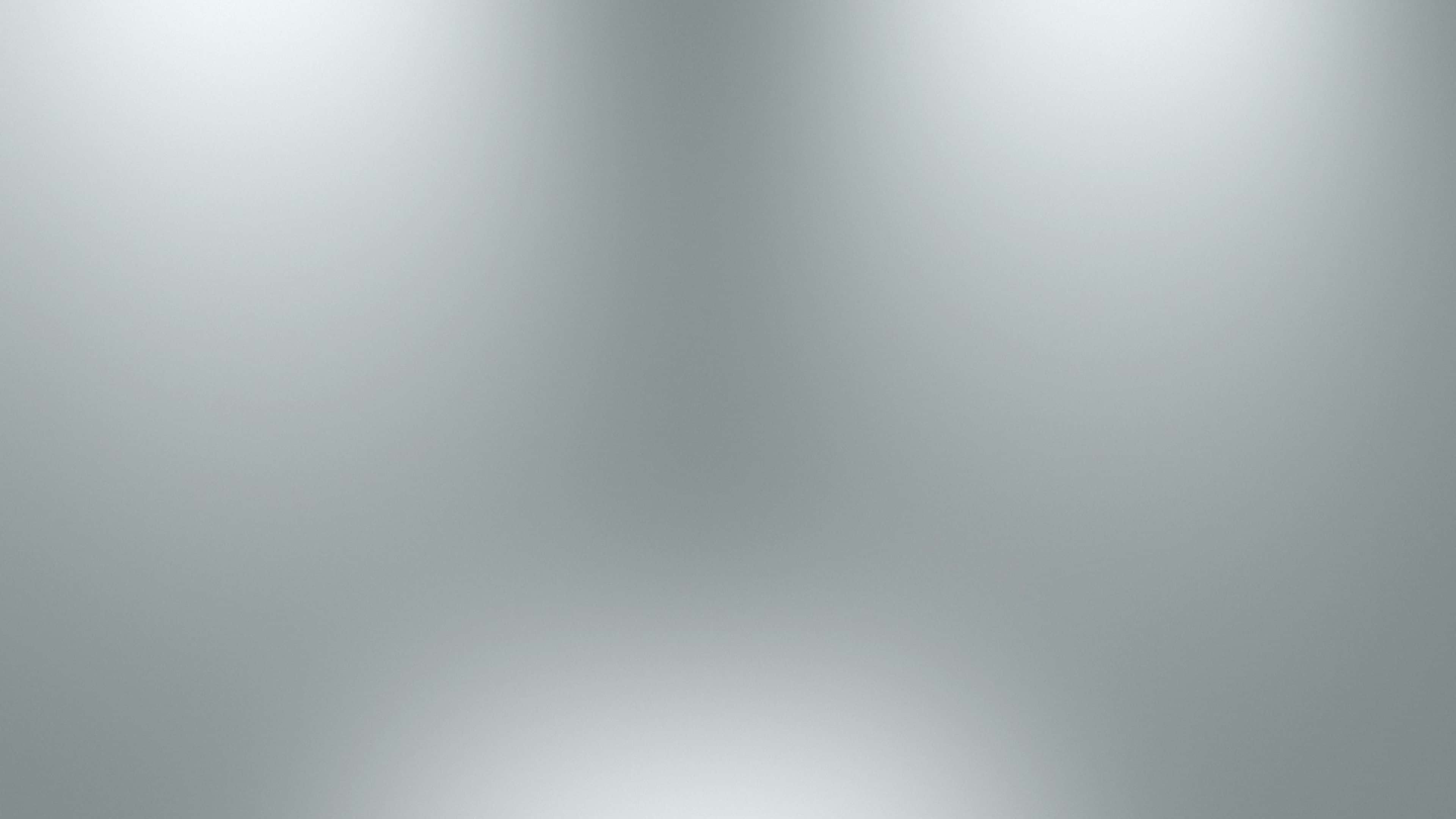 Gray Gradient 桌布 壁紙 — 柔和的冷灰色調漸變，從明亮漸變到柔和中心。