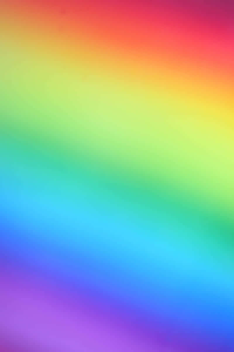 Rainbow Gradient 桌布 壁紙 — 柔和的彩虹色漸變，以平滑的粉彩調色板對角線流過畫面。