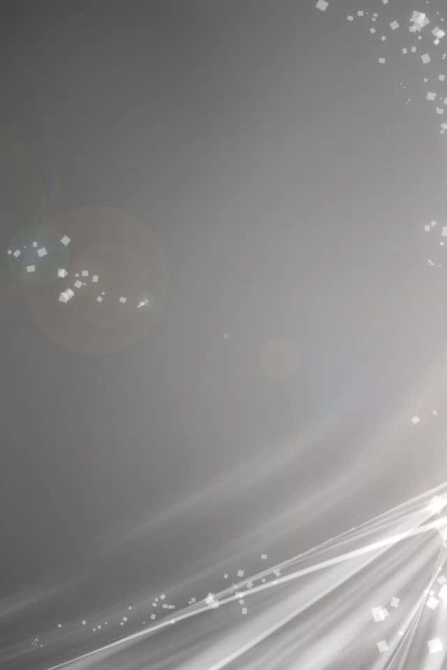 Light Gray iPhone 桌布 壁紙 — 柔和的灰色漸變背景，帶有發光的光條和散落的閃爍粒子，營造出夢幻般空靈的效果。