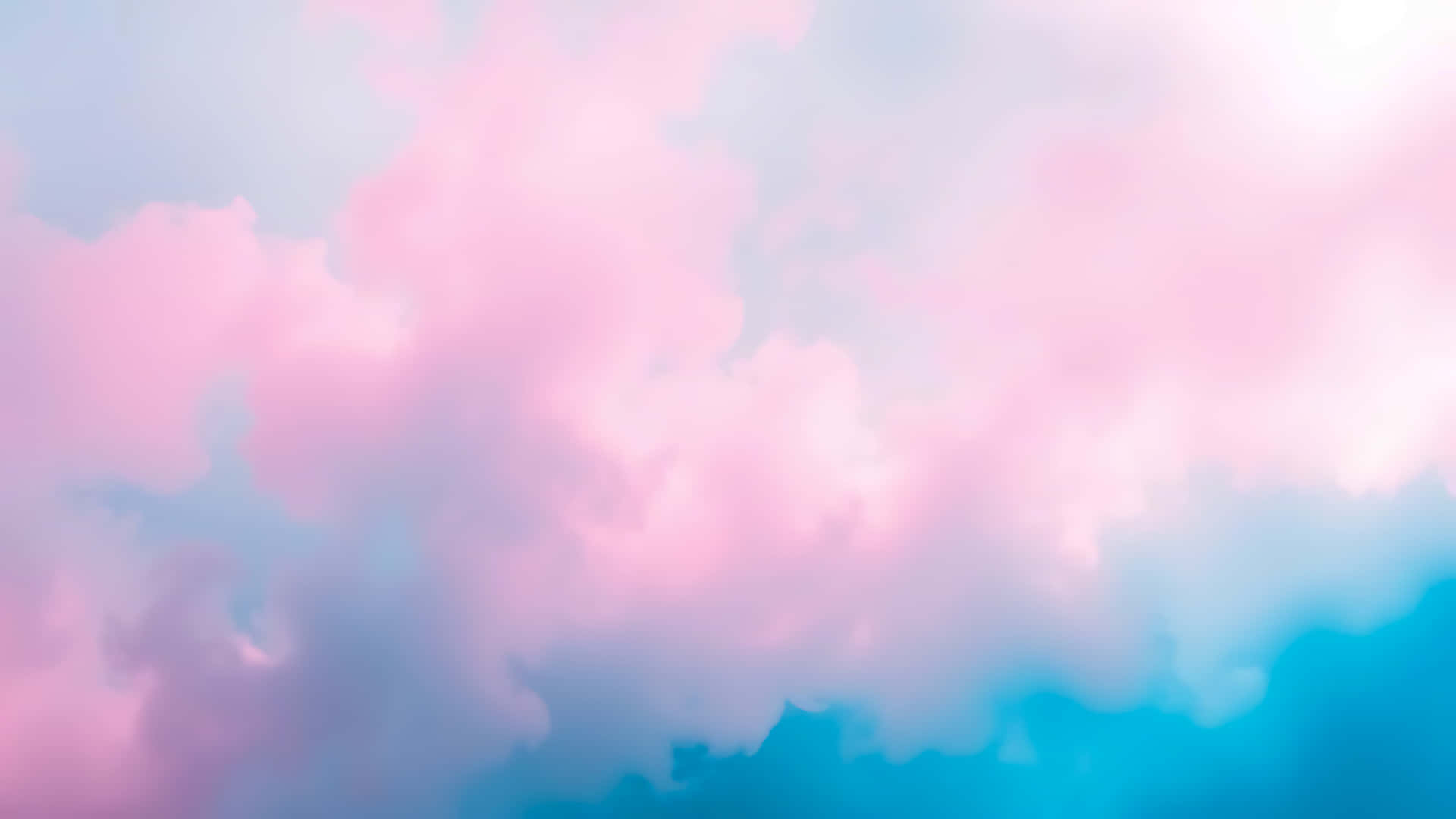 Abstract pink and blue clouds creating a dreamy pastel background 壁紙 — 柔和的粉彩雲朵在夢幻的天空中以柔和的粉紅色和藍色色調旋轉。