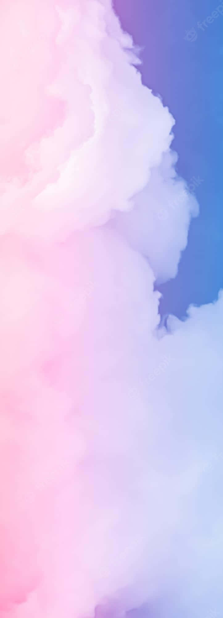 Pink And Blue Clouds 桌布 壁紙 — 柔和的粉彩雲朵在粉紅與藍色天空的夢幻漸變中旋轉。