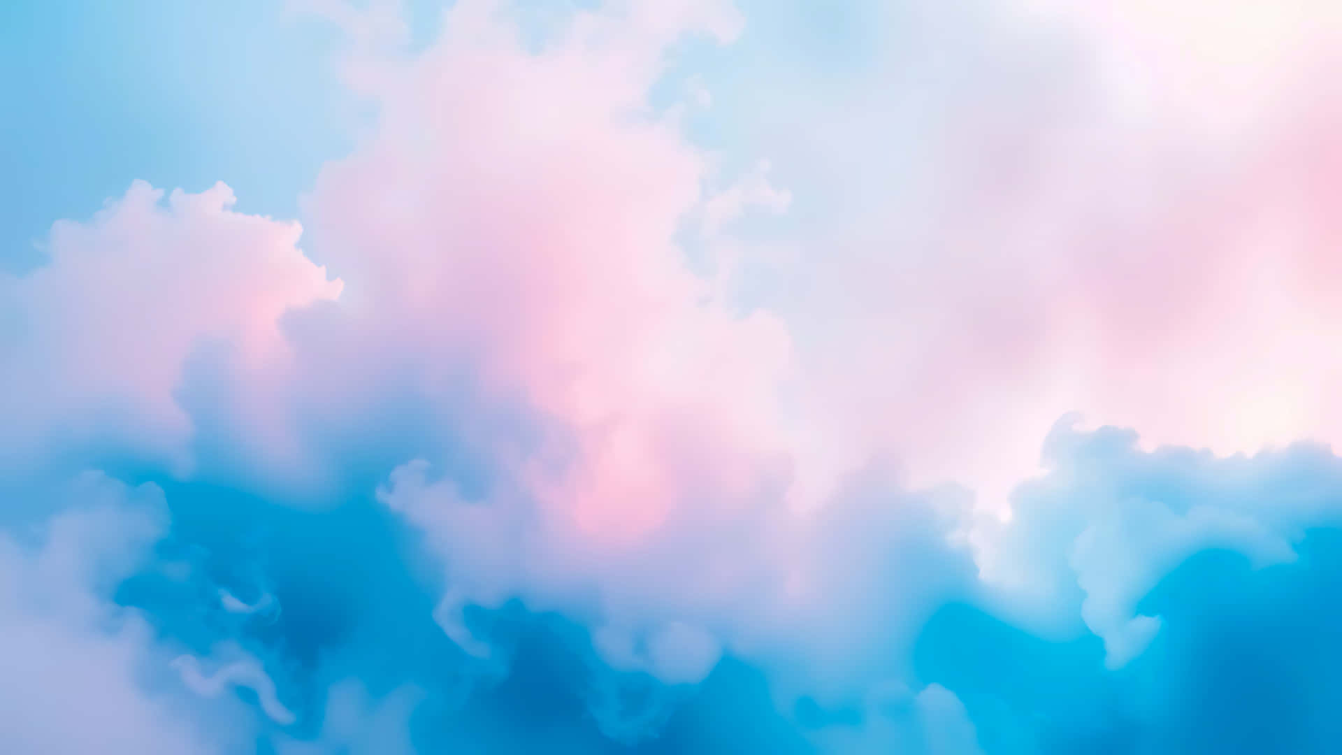 Dreamy pink and blue clouds creating a soft and ethereal atmosphere 壁紙 — 柔和的粉紅和藍色粉彩雲朵夢幻地融合在溫柔的天空中。
