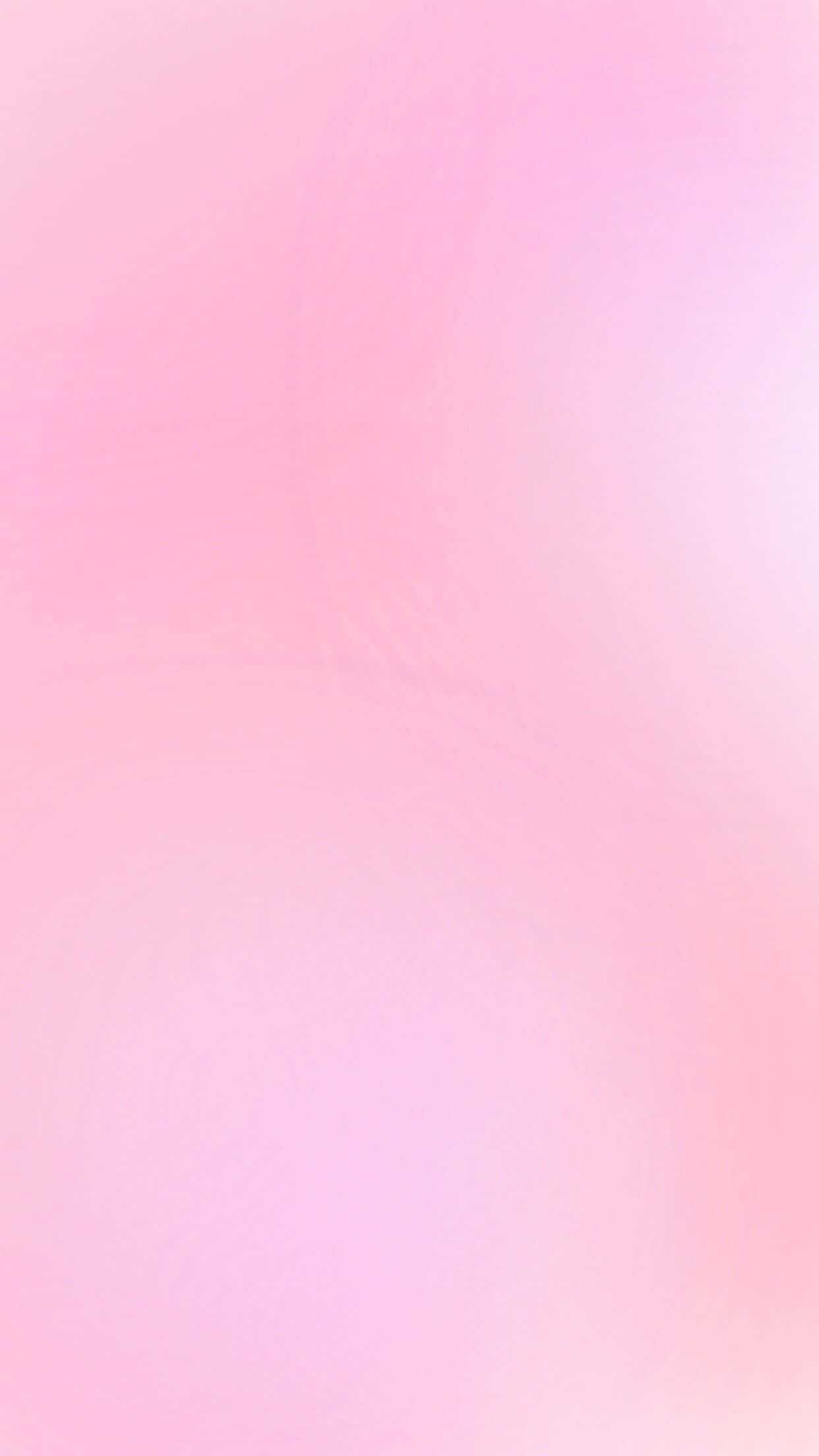 Pink Pastel 桌布 壁紙 — 柔和的粉紅色和淺蜜桃色漸變，帶有微妙的漩渦紋理。