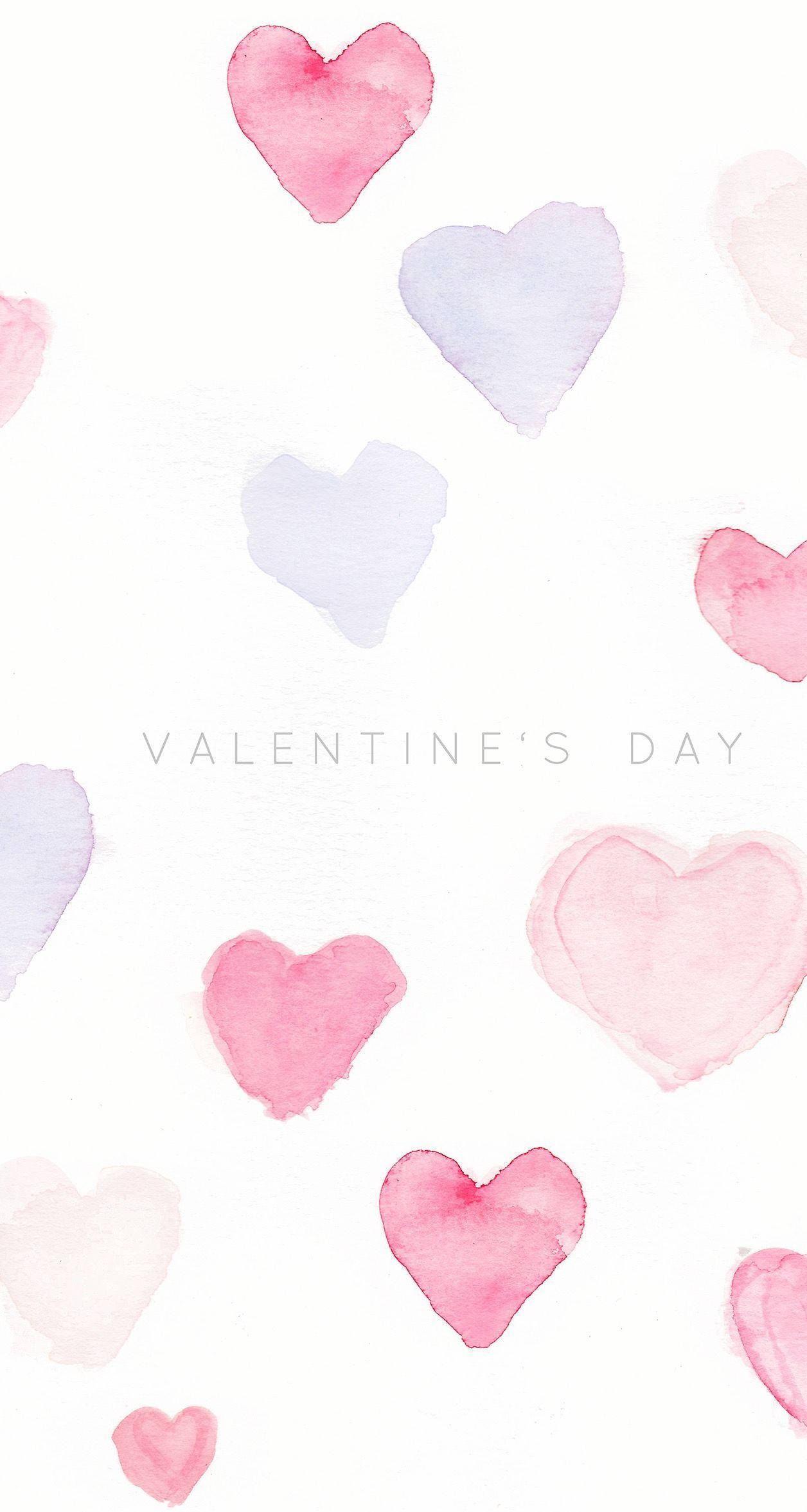 Tumblr Valentines Day 桌布 壁紙 — 柔和的粉紅色和薰衣草色水彩心形在乾淨的白色背景上輕輕漂浮，帶有 'VALENTINE'S DAY' 文字。