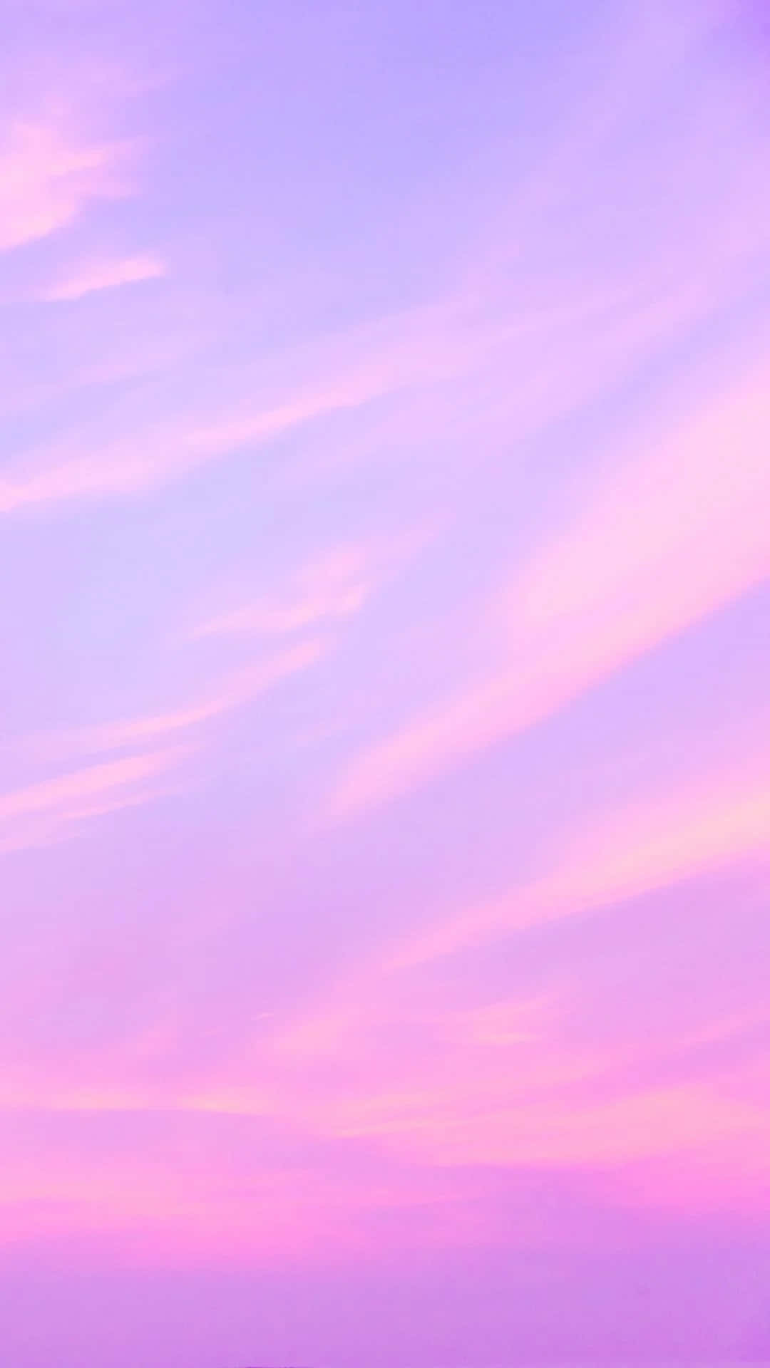 Lock Screen iPhone 桌布 壁紙 — 柔和的粉紅色和薰衣草色雲彩在寧靜的暮色天空中蔓延。