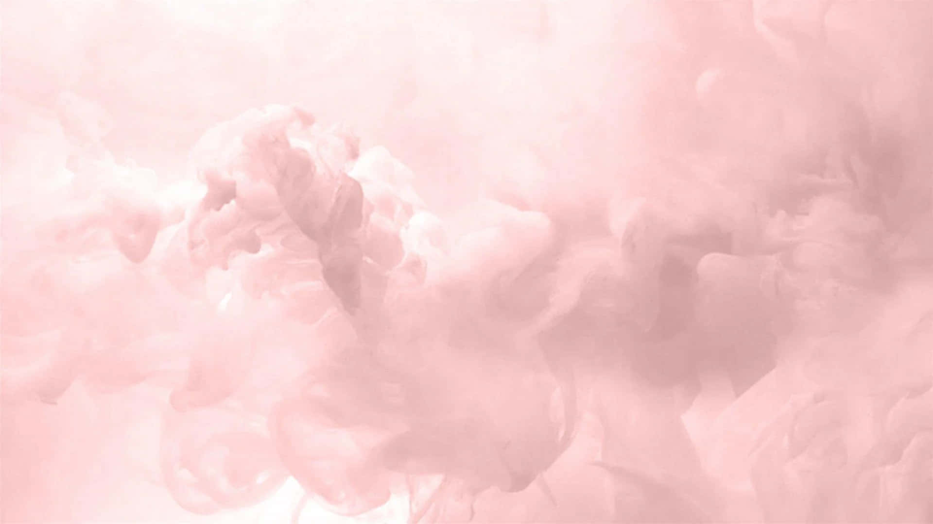 Rose Gold Desktop 桌布 壁紙 — 柔和的粉紅色墨水漩渦在清澈的水中輕輕擴散，營造出空靈夢幻的抽象構圖。