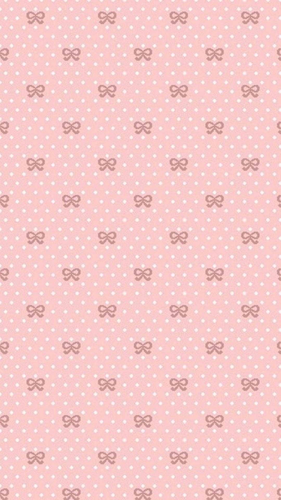 cute and pink 桌布 壁紙 — 柔和的粉紅色壁紙，帶有重複的白色圓點和柔和粉紅色蝴蝶結圖案，整齊排列成網格。