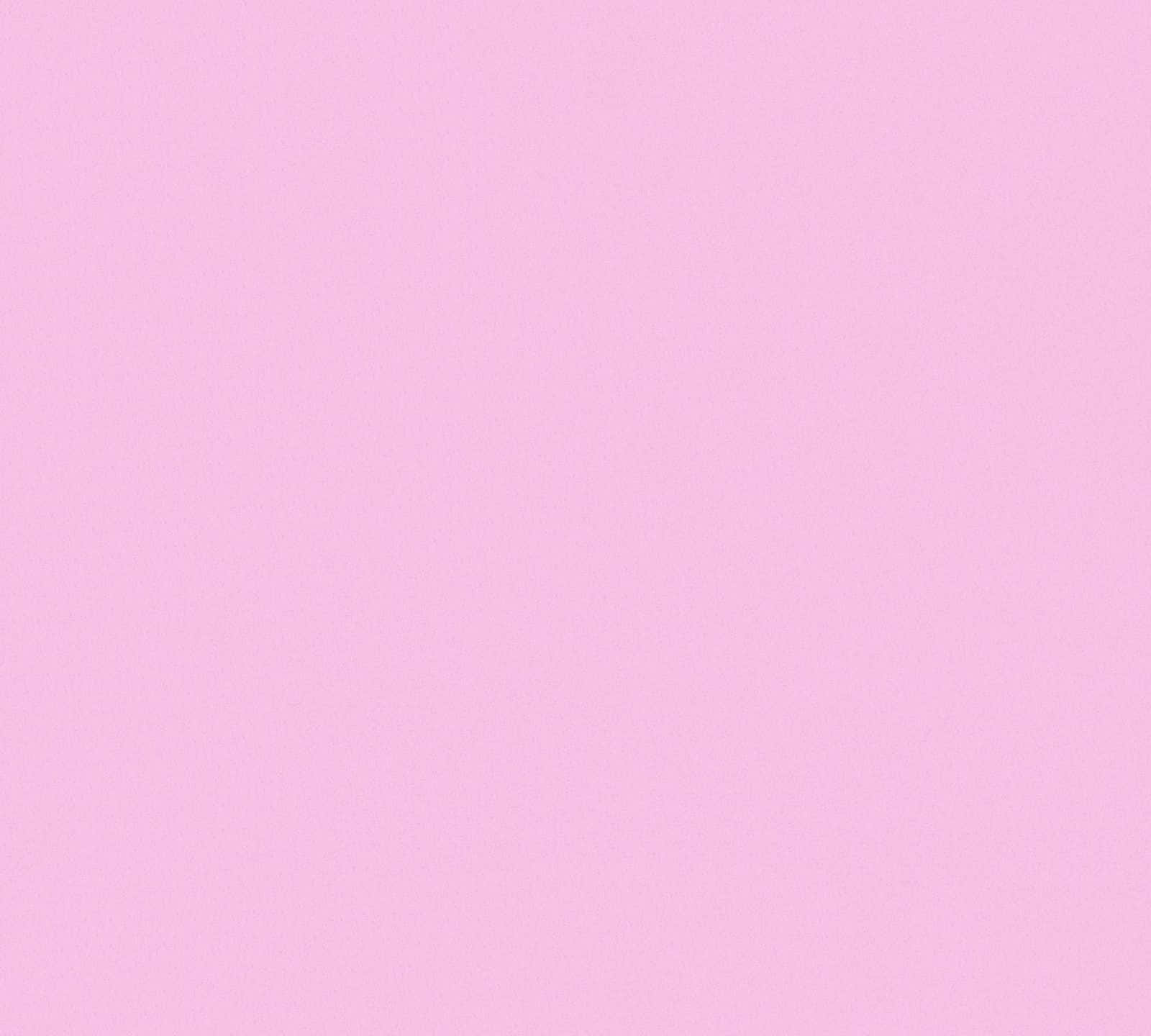Plain Pink Desktop 桌布 壁紙 — 柔和的粉紅色紋理背景，帶有微妙的顆粒表面細節。
