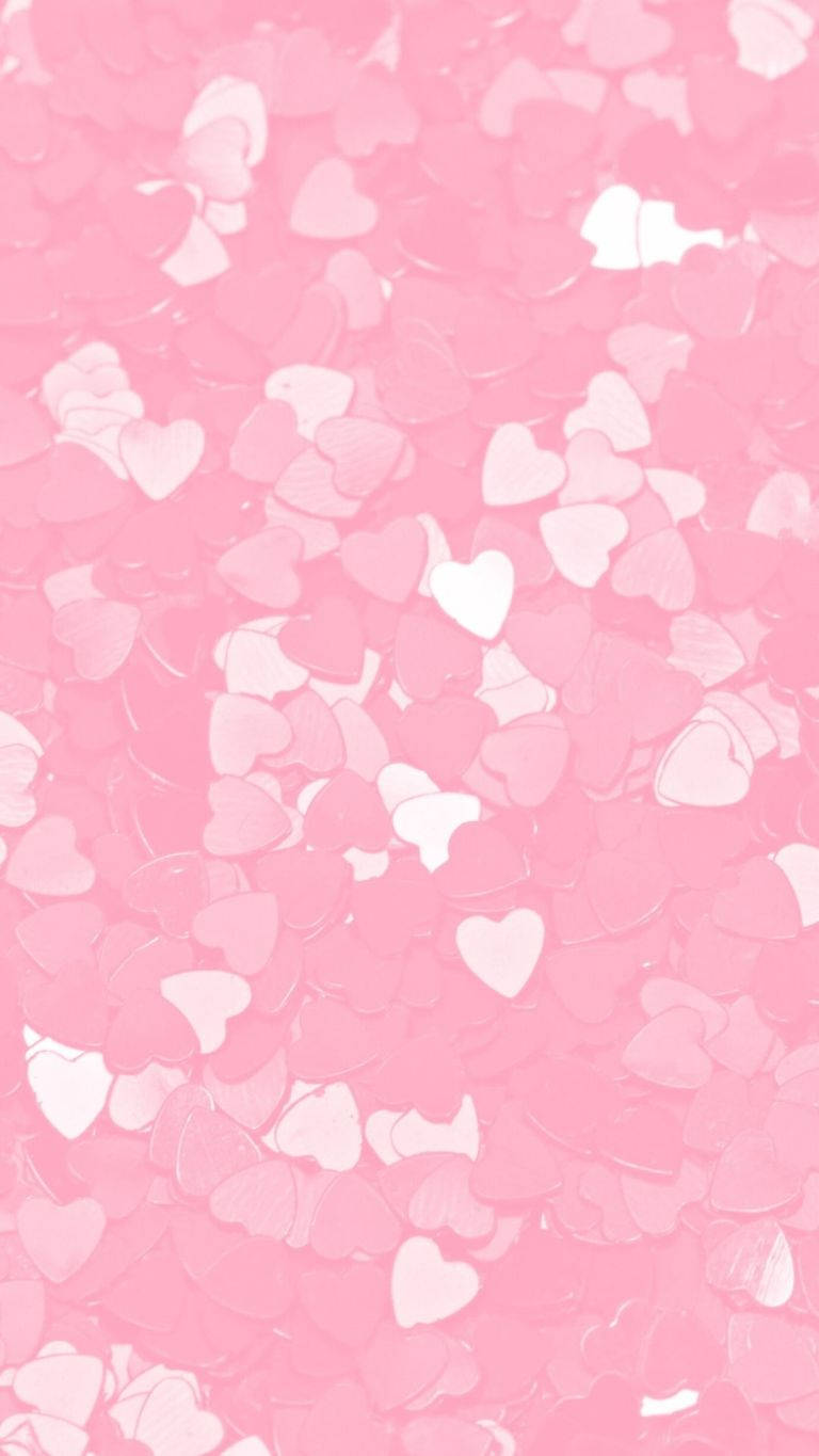 Y2k Heart 桌布 壁紙 — 柔和的粉紅色背景，散落著半透明的白色心形圖案，營造出溫柔浪漫的圖案。