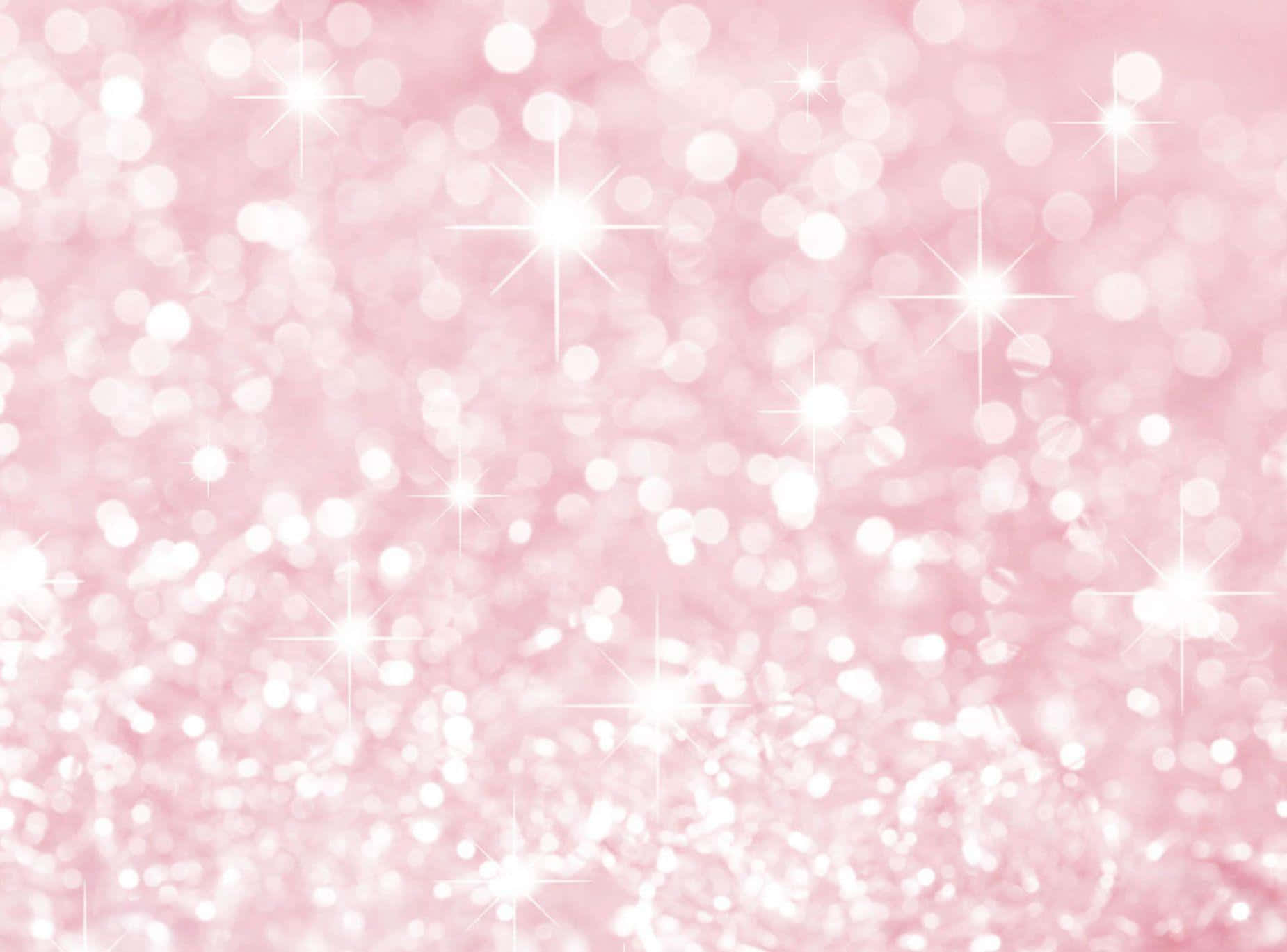 Pink Sparkles 桌布 壁紙 — 柔和的粉紅色背景，閃爍著白色散景燈光和閃爍的星爆，營造出夢幻的節日氣氛。